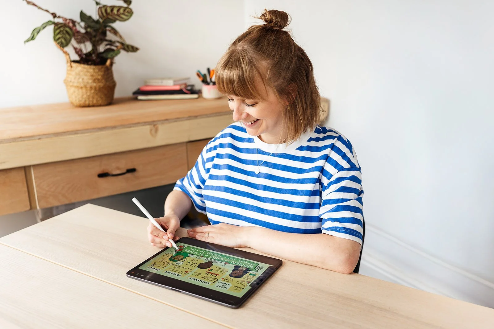 A portrait of a live illustrator, to accompany an article on how much does live illustration cost