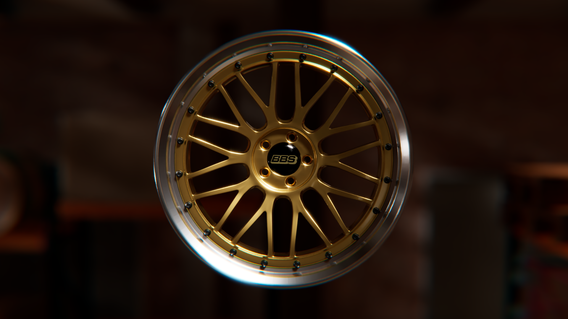 Jante de voiture dorée avec le logo BBS au centre, sur fond sombre et flou.