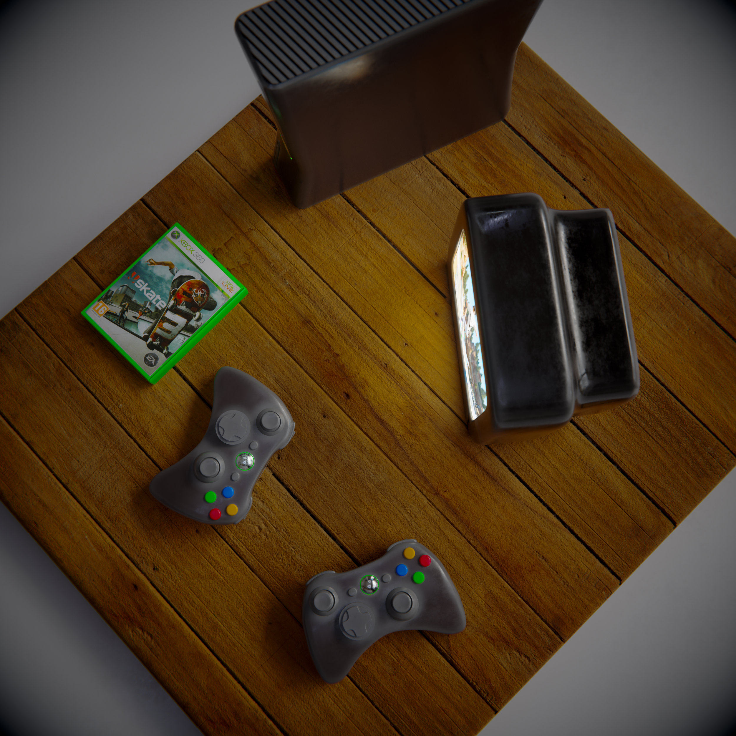 Une table en bois avec une boîte de jeu vidéo, deux manettes de jeu, une console et un porte-menus