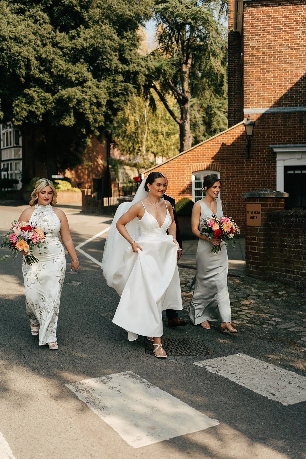 Bride walking with bridesmaids to the ceremony