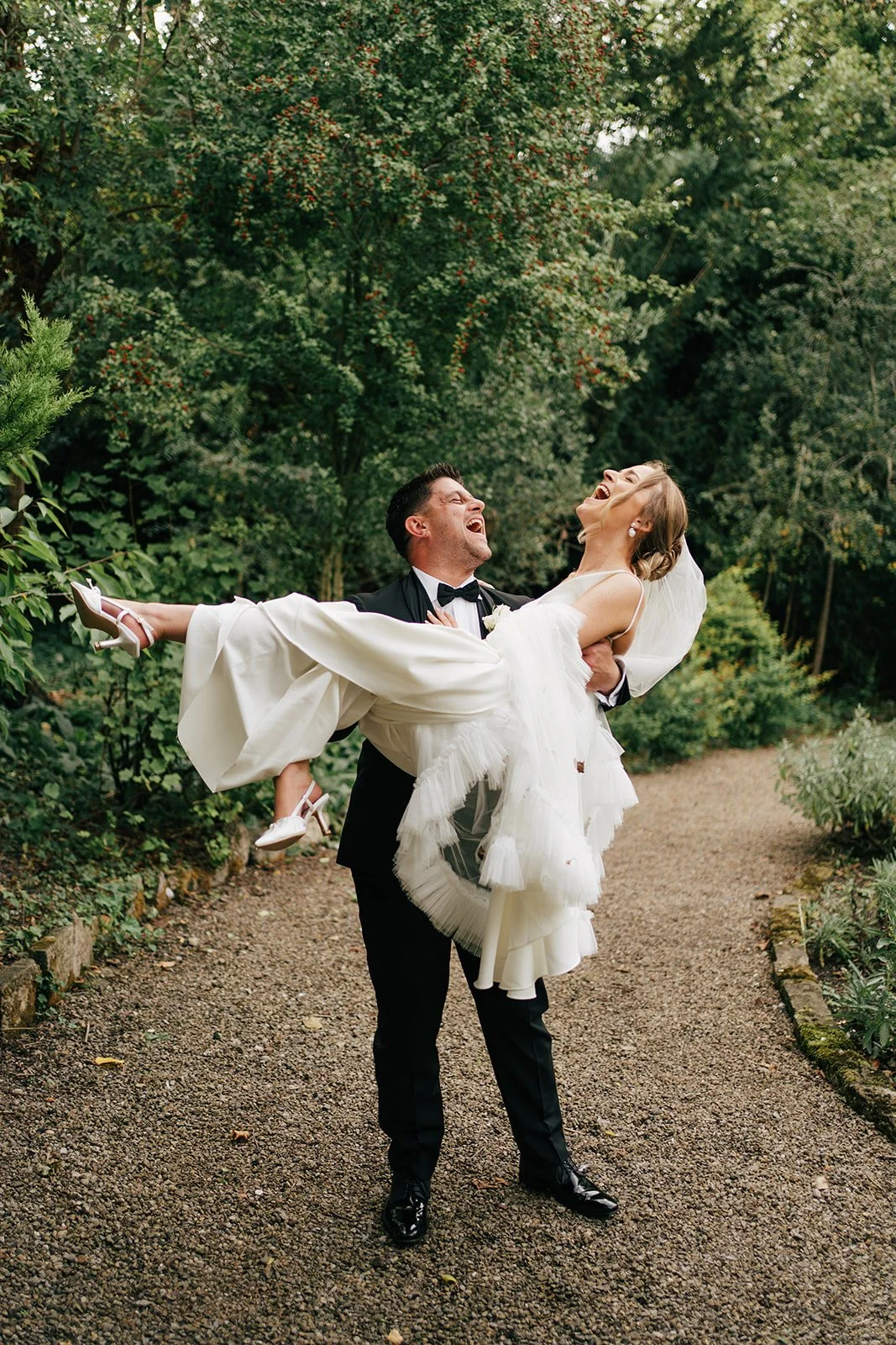 Bride and groom laughing together during a candid moment