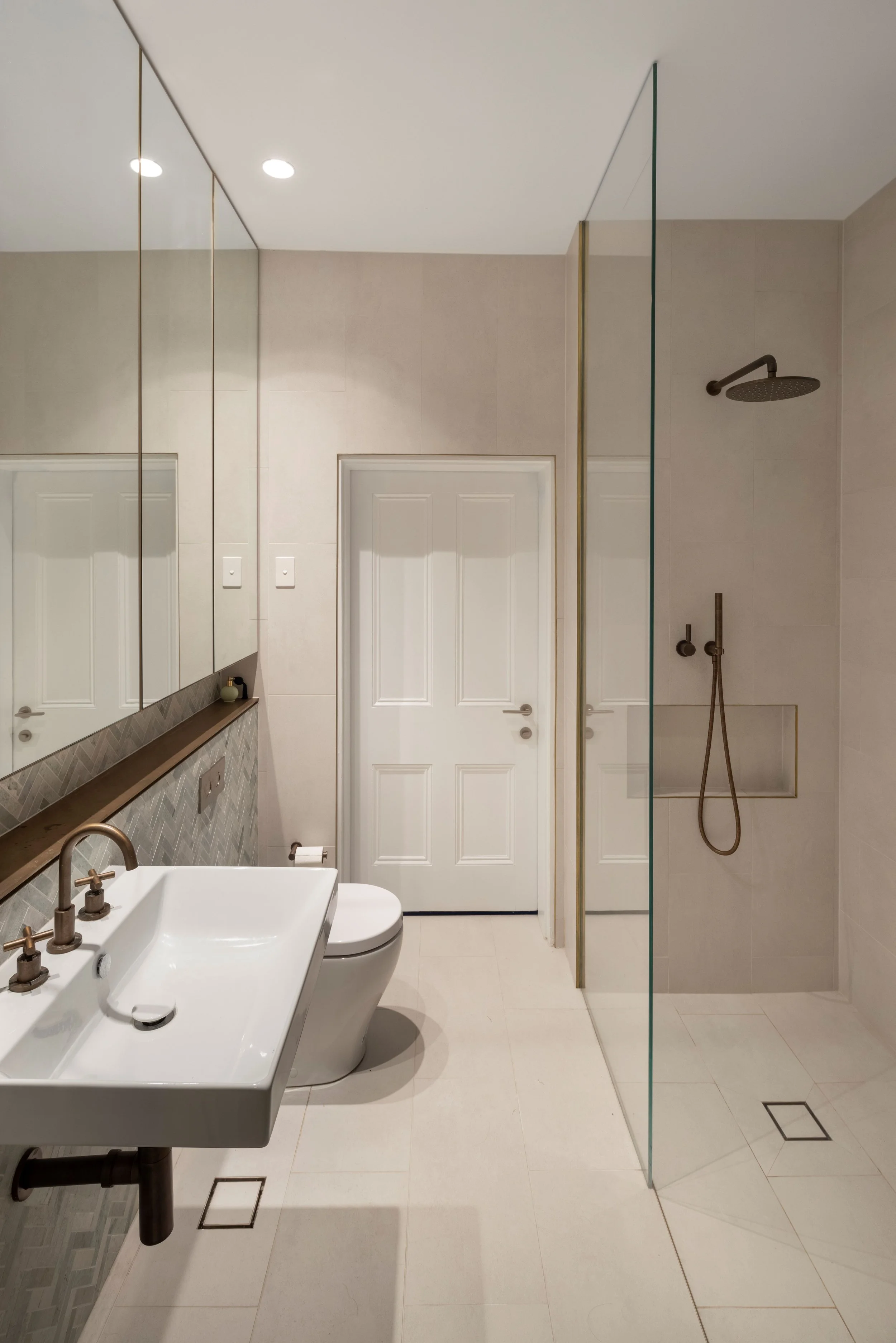 Bathroom design brass and stone