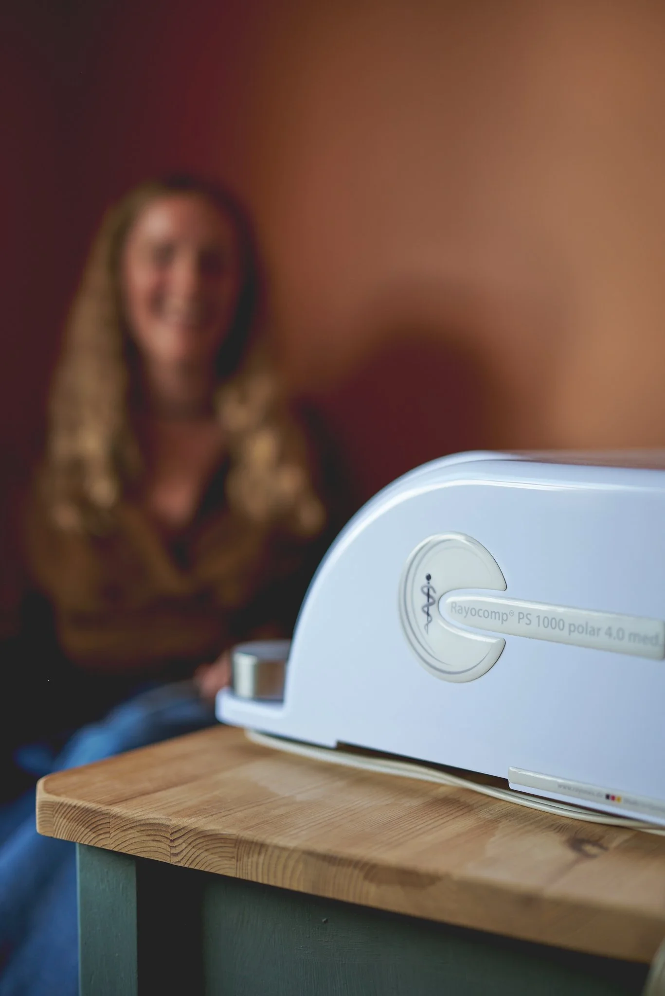 Close up of Bioresonance machine with practitioner in the background