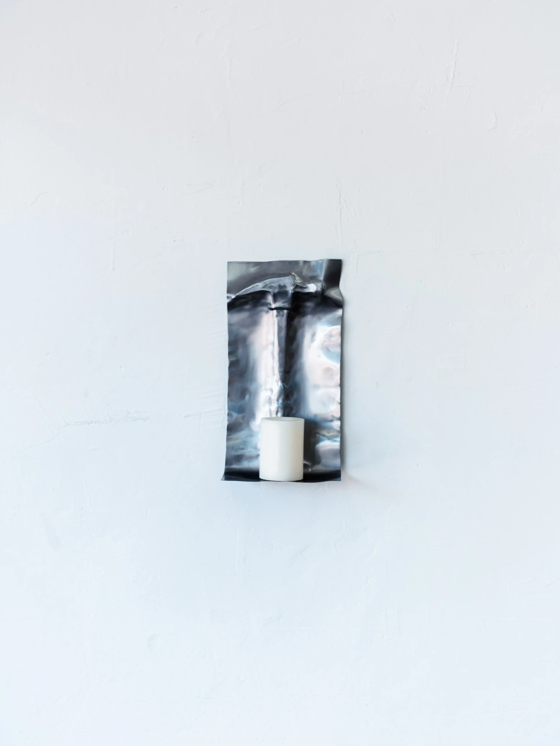 Need a Light? 
2026
Metal sheet, roofing nail, candle 
15 x 8 x 3.5 in.
(INQUIRE)