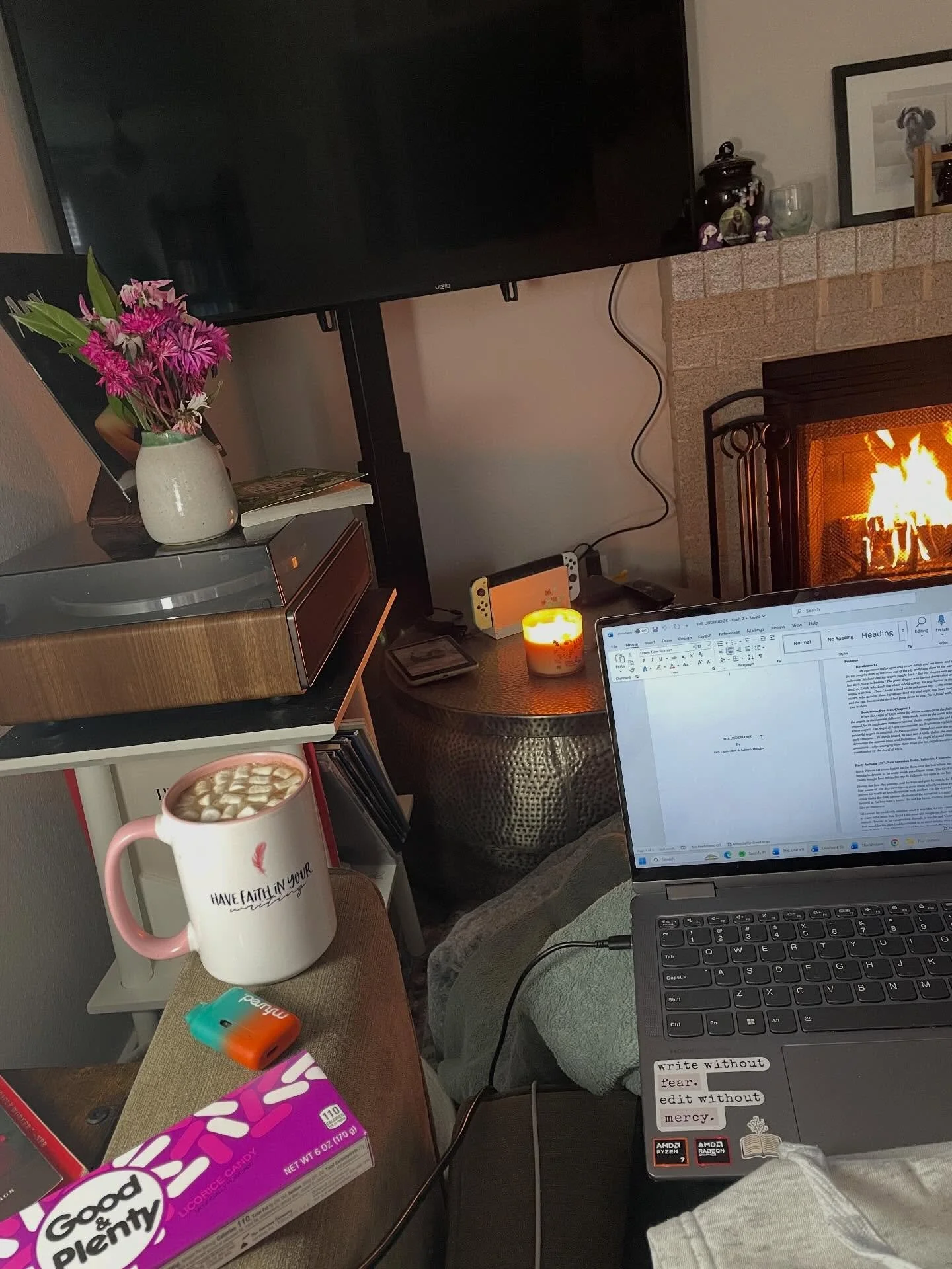 Writing cave:

Boozy hot chocolate, roaring fire, Good &amp; Plenty, Miles Davis, &amp; a rainy afternoon. 

I&rsquo;m living a dream.