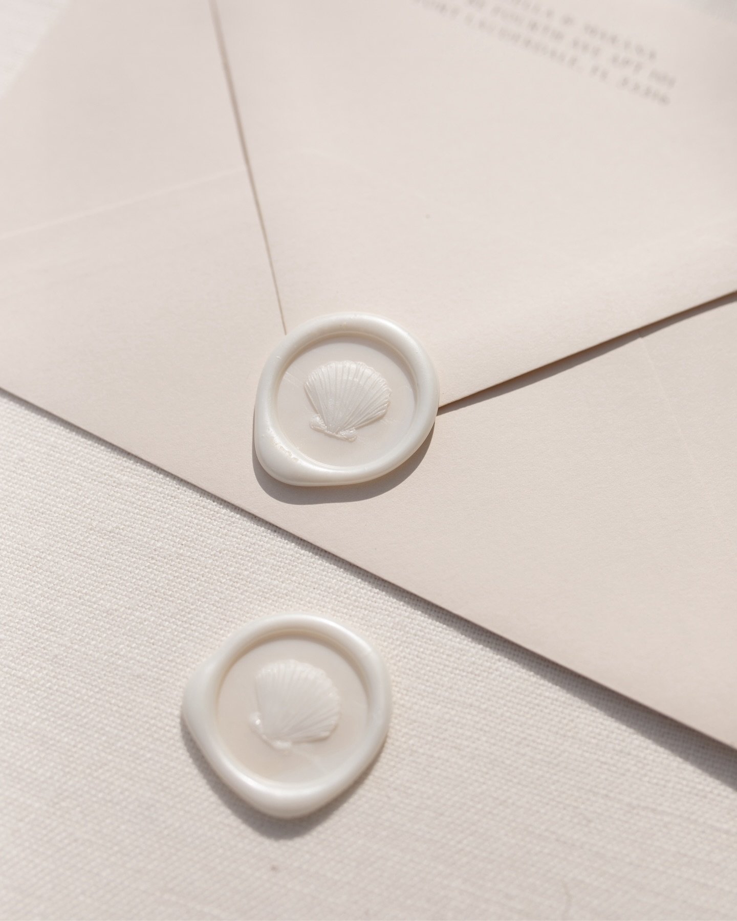 Embellishments; the extra bit that makes your wedding stationery even more personal to you.  These pearlescent shell wax seals were part of some beautiful Save The Dates for G + K. 🤍🐚

#savethedate #stationerydesign #keyswedding #summerwedding #wax