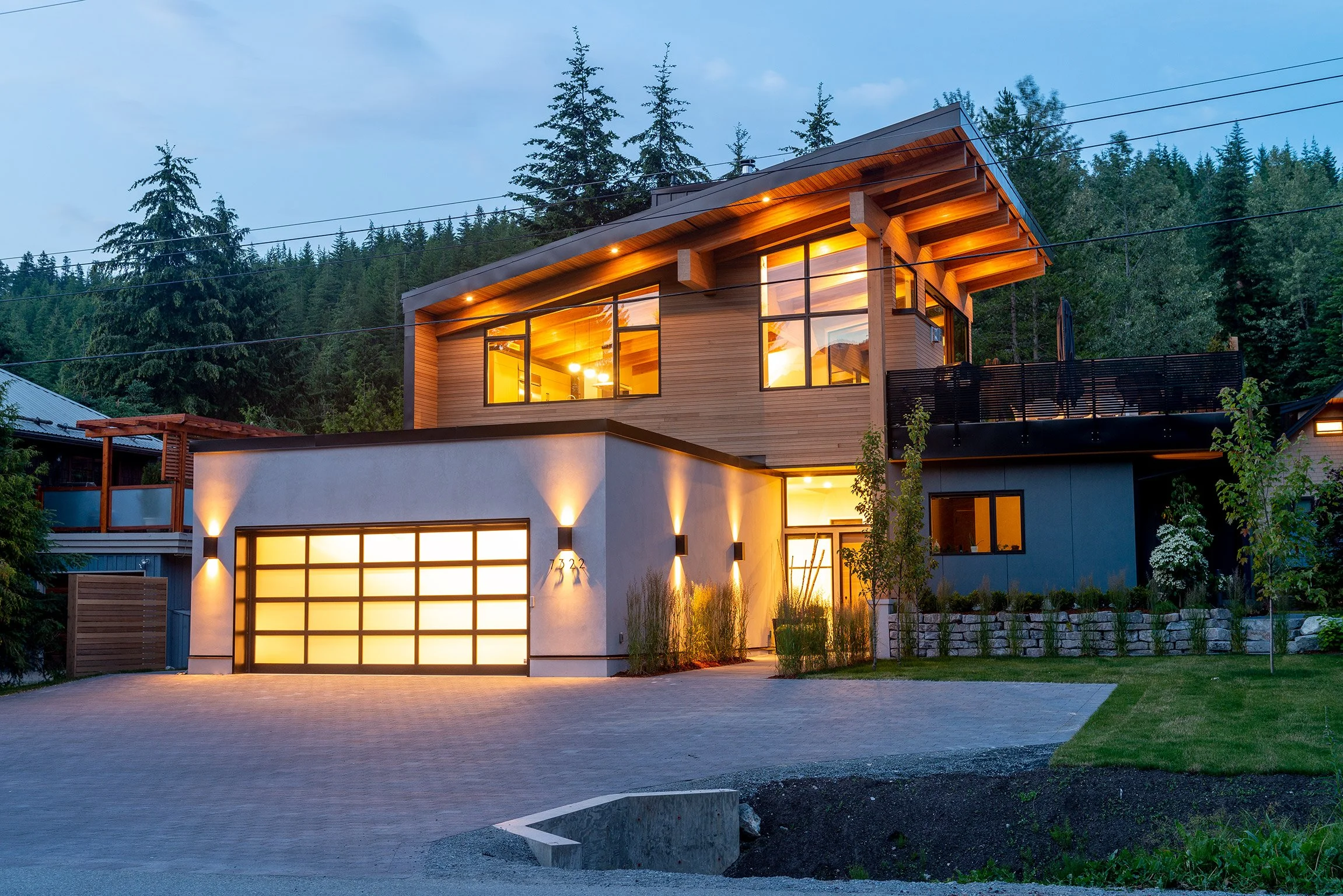 Custom Whistler residence with exposed timber roof and energy‑efficient SIP and ICF construction by Golden Spruce
