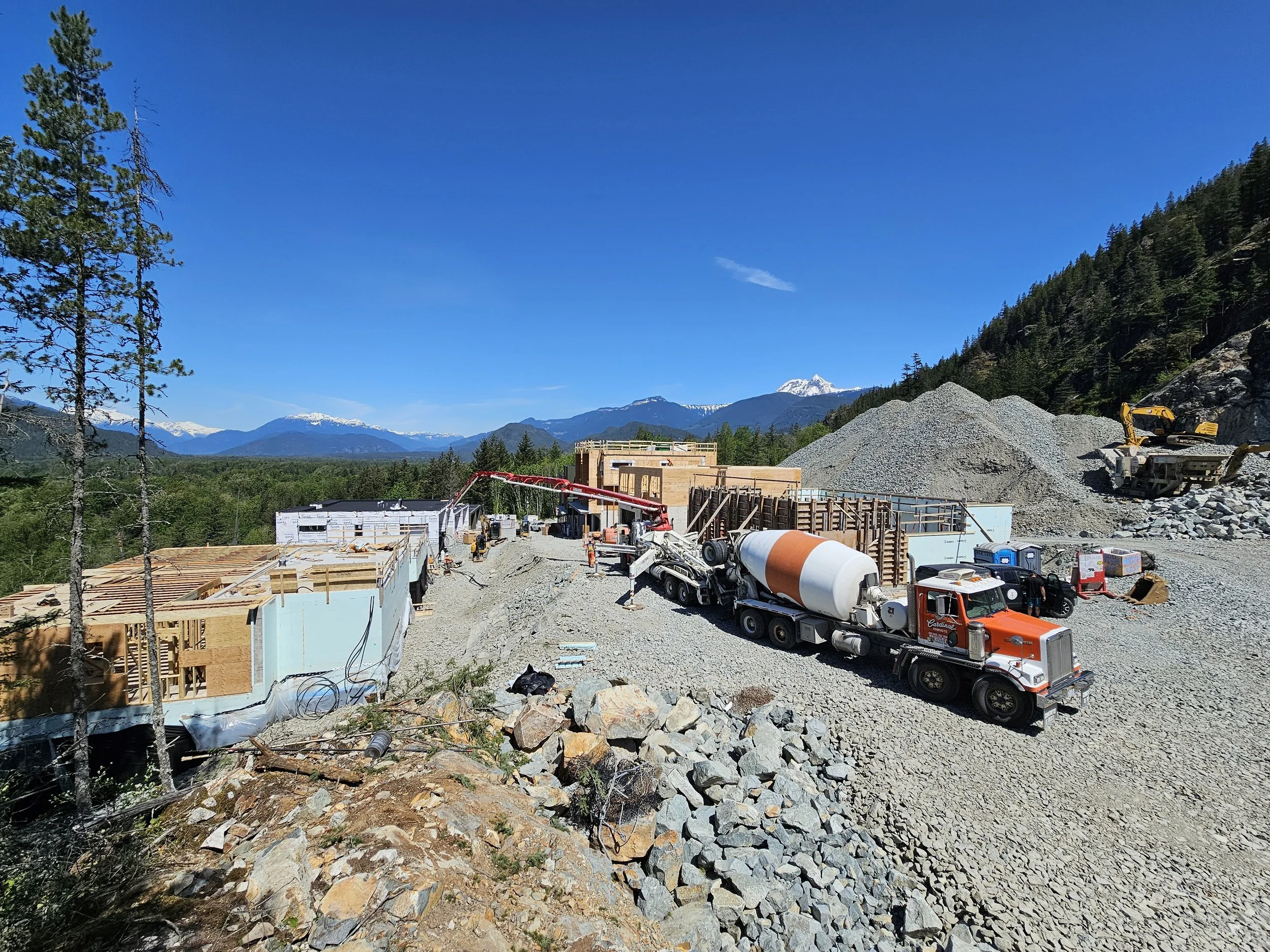 Modern Step 5 duplexes in the Sea‑to‑Sky Corridor with geothermal systems and ICF/concrete construction by Golden Spruce.