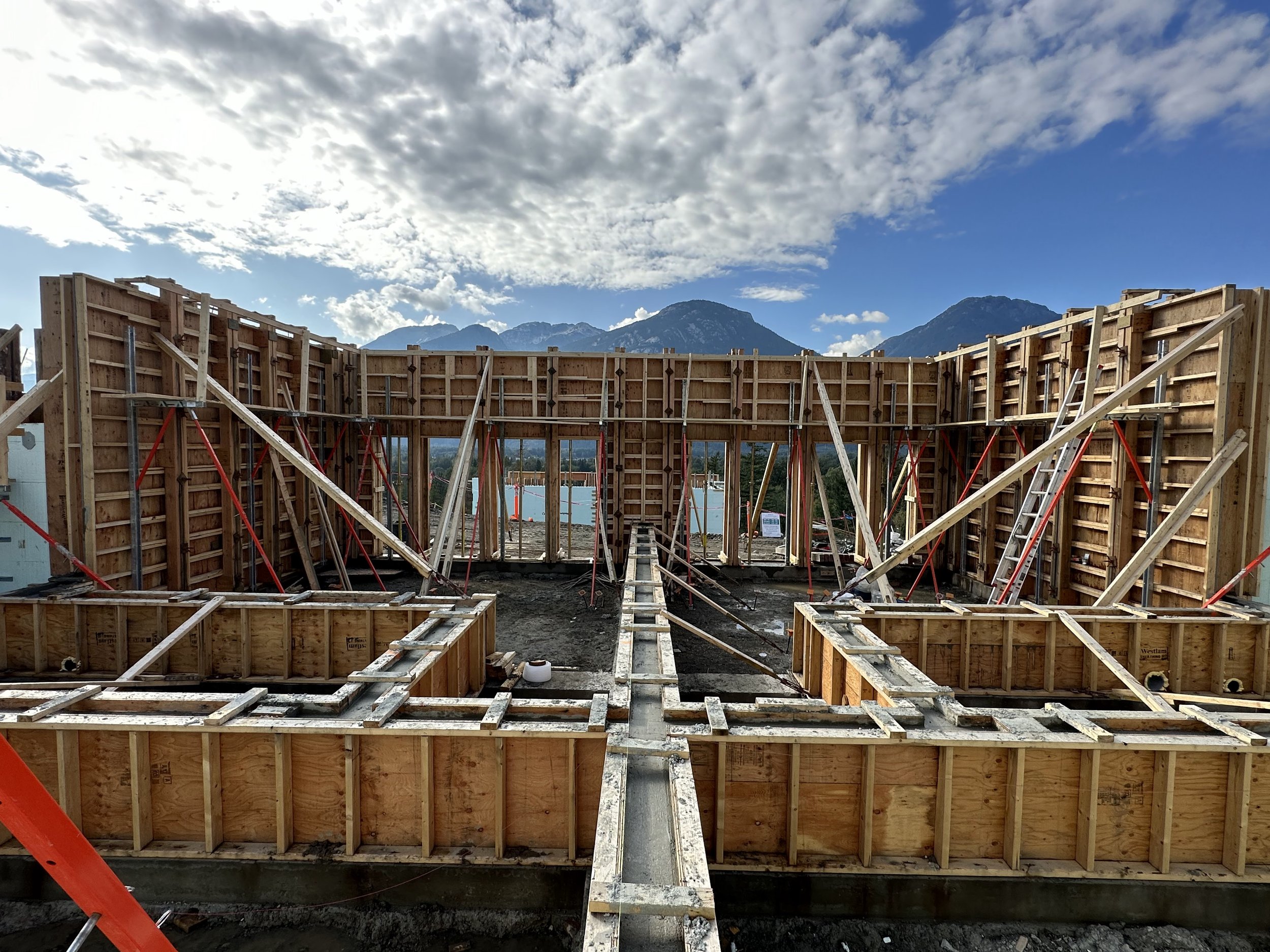 Modern Step 5 duplexes in the Sea‑to‑Sky Corridor with geothermal systems and ICF/concrete construction by Golden Spruce.