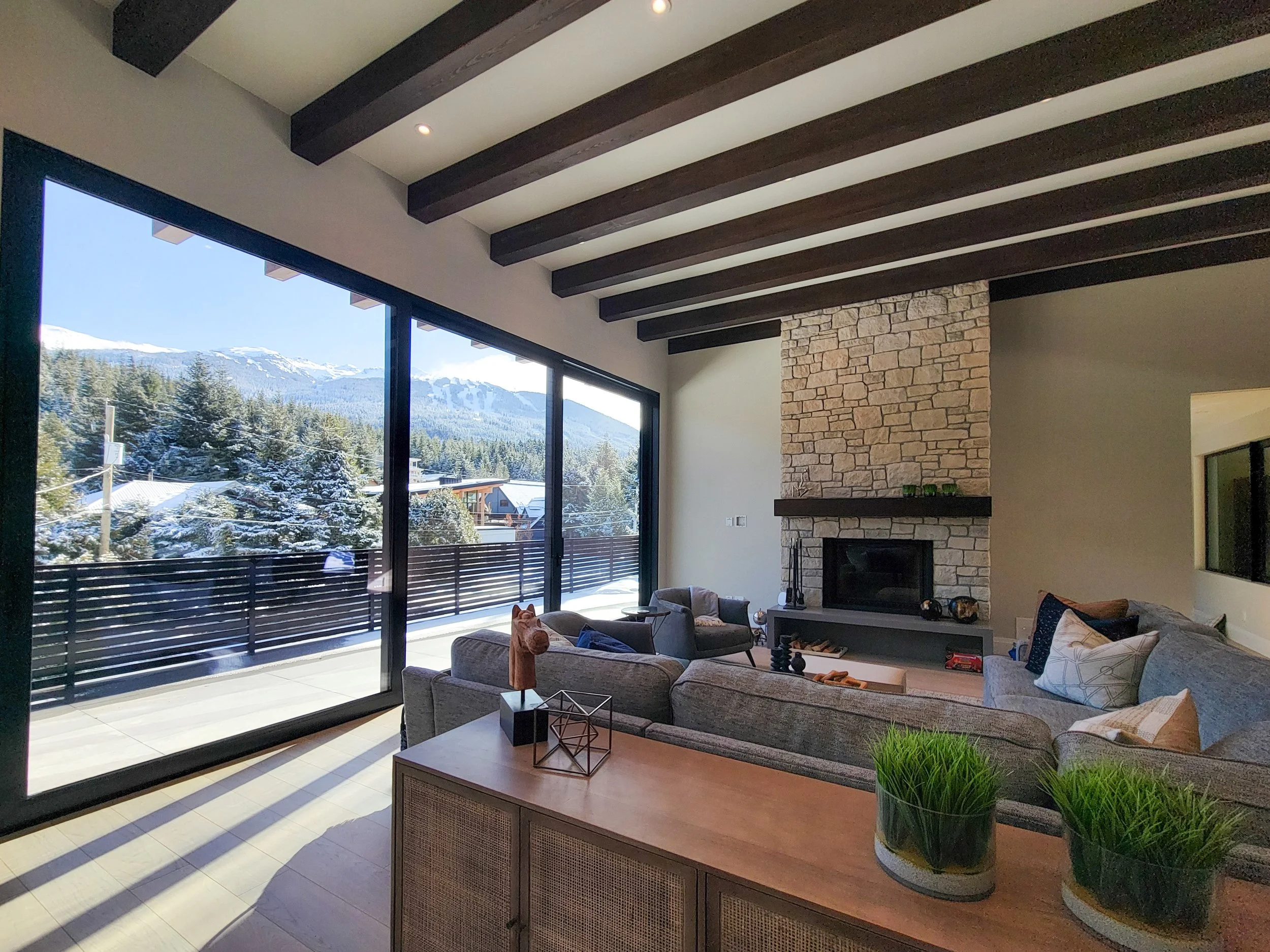 Architecturally striking White Gold custom home featuring a single-tree oak staircase, mountain-facing decks, and high-performance, durable materials for modern mountain living.