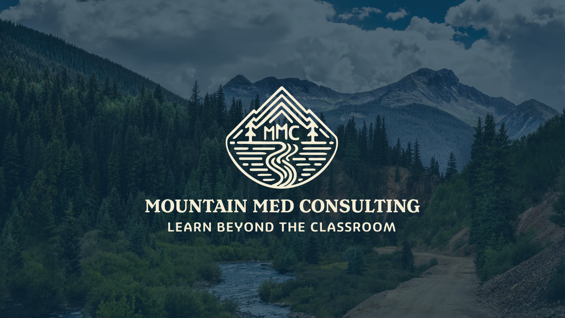 Person holding a brochure for Mountain Med Consulting with the slogan 'Learn Beyond the Classroom', next to a glass of water on a table.