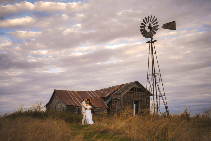 Bride & Groom w/old house