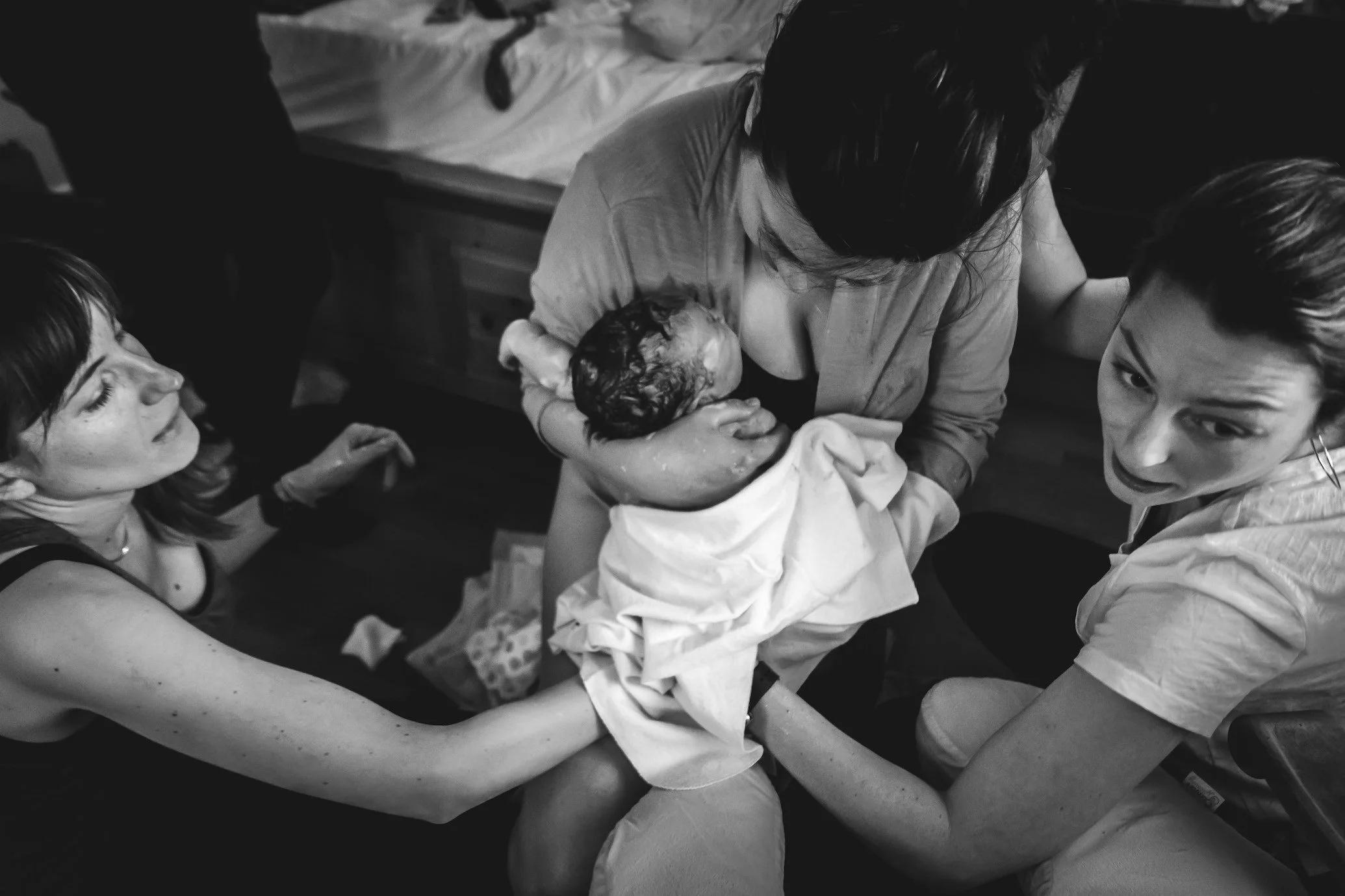Midwife Renee and Midwife Amanda Kessner supporting a client moments after her beautiful home birth in Walnut Creek, CA