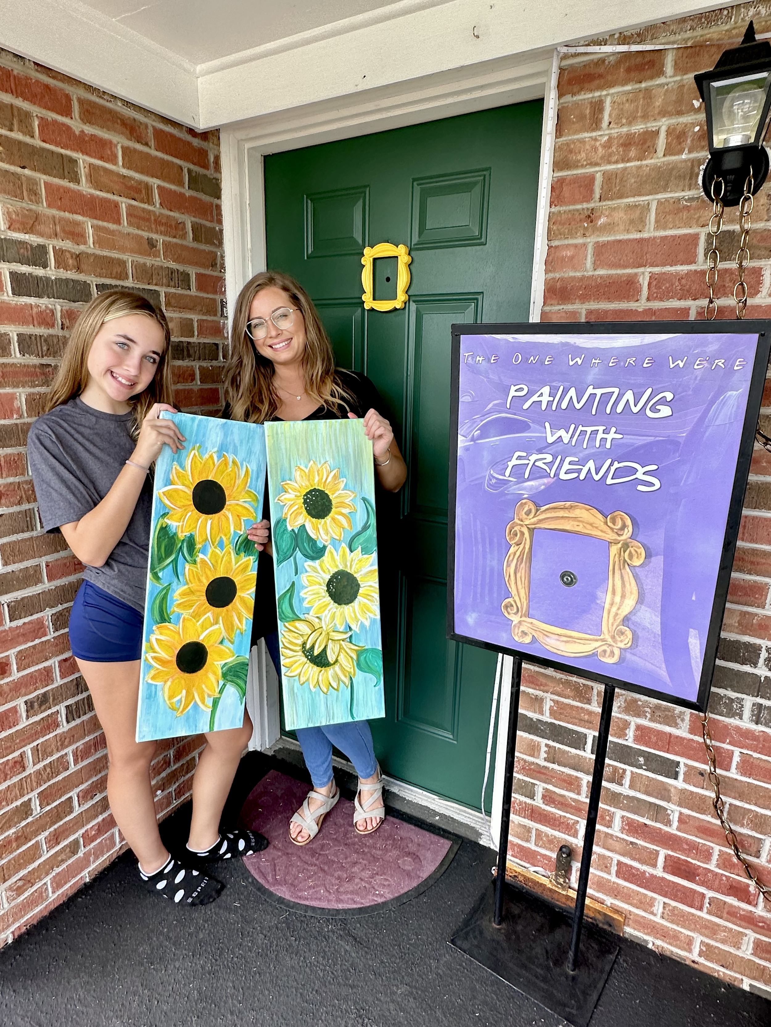 People Holding Paiting.png