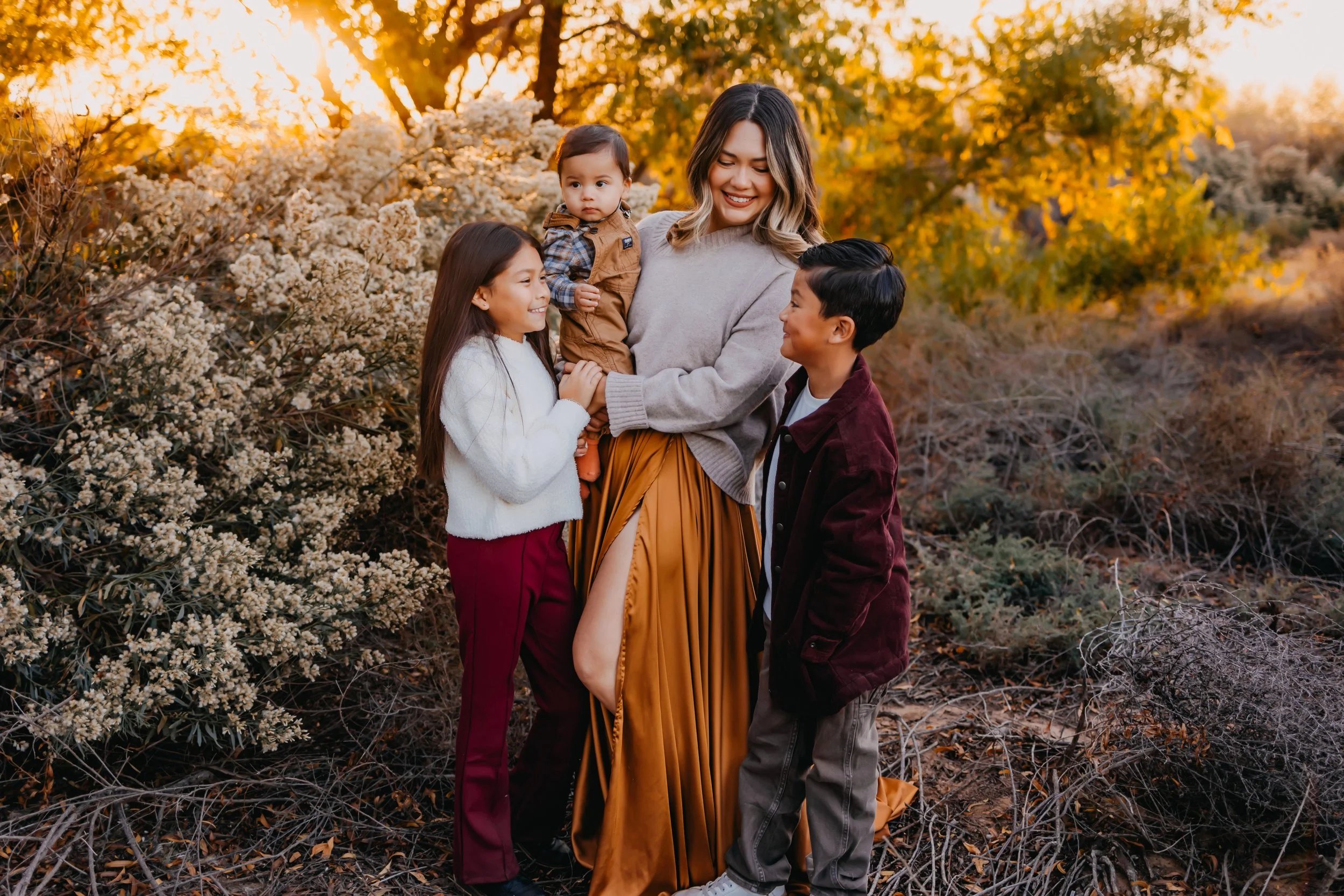 mother with her three children sharing loving looks