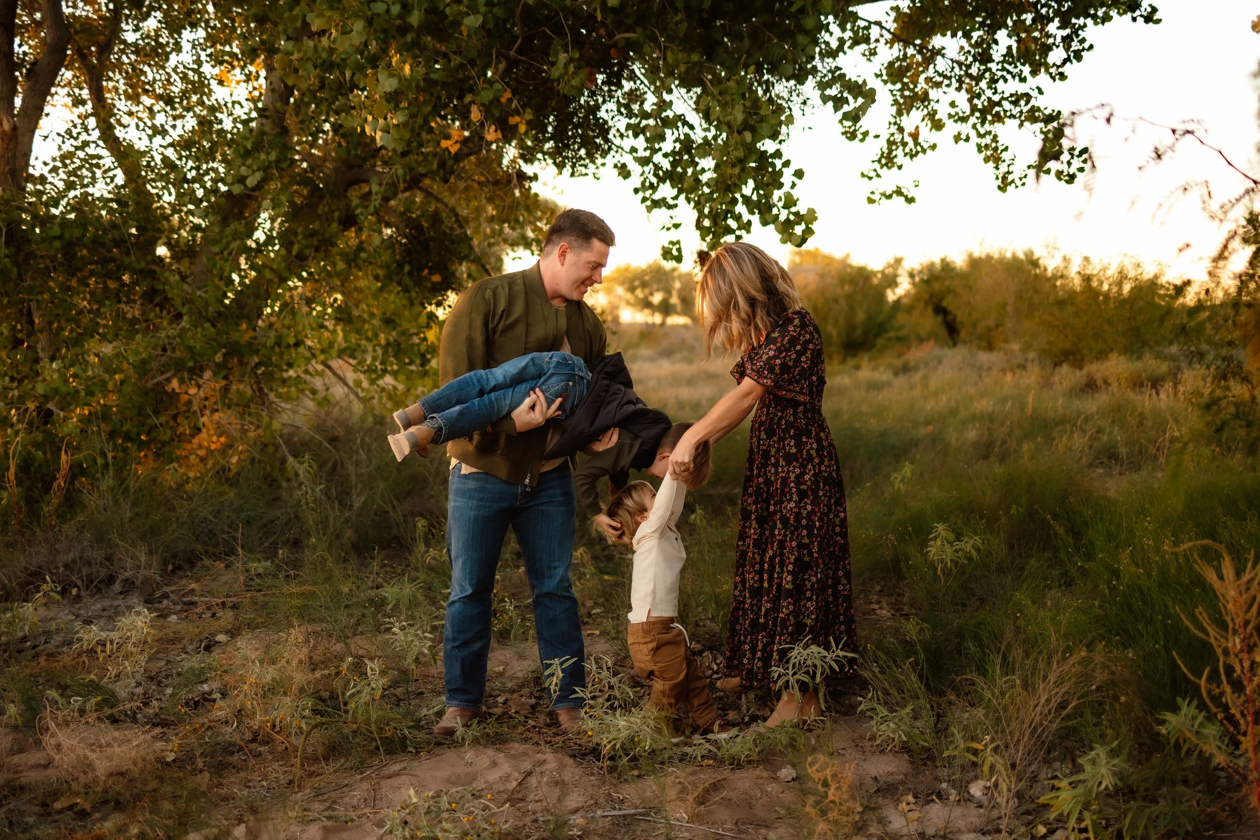 family playing together by a tree, el paso tx family photographer