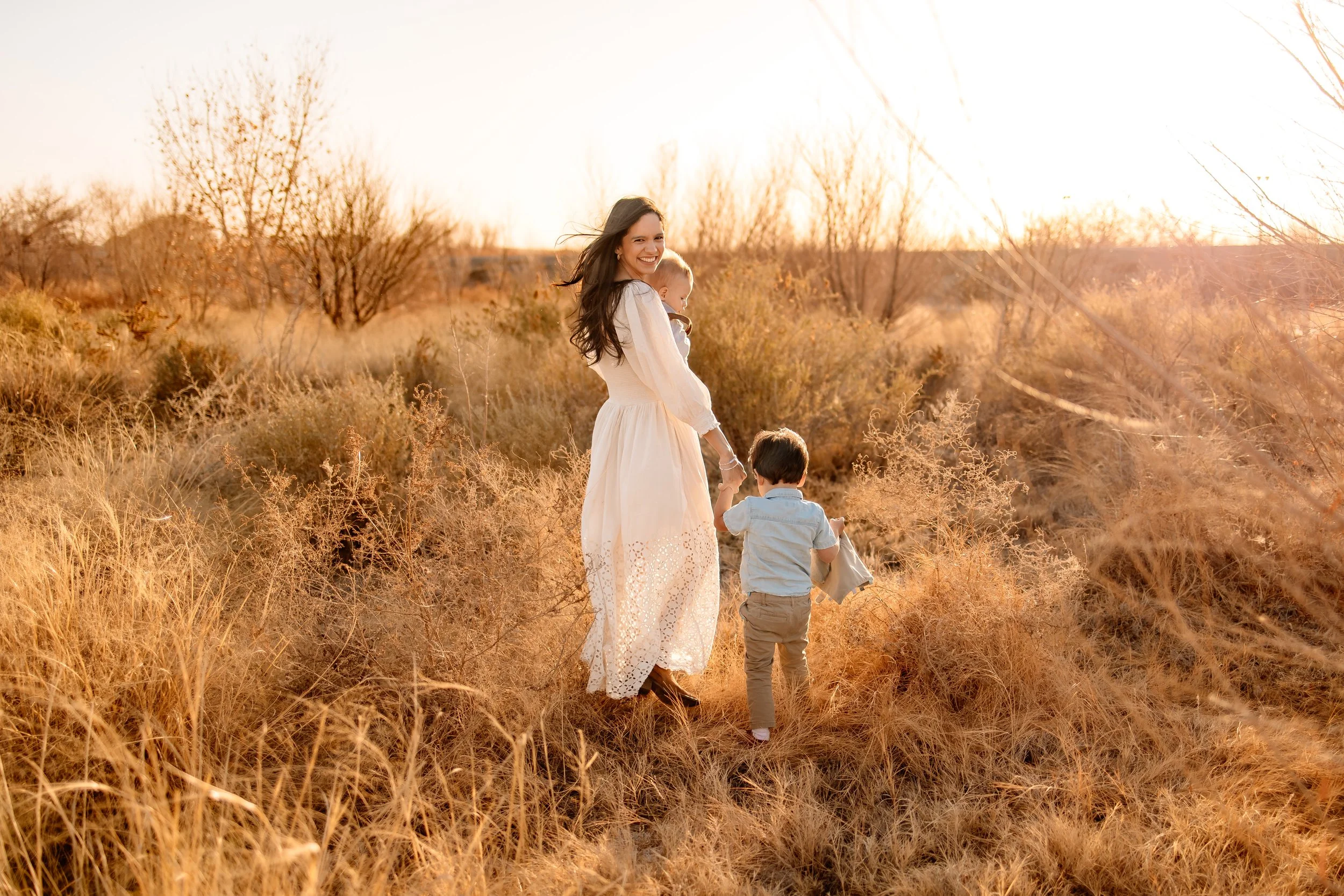 a mom  walks with her toddler boys, el paso, tx photographer breastfeeding mom, el paso tx family photographer let kids be kids candid photography 