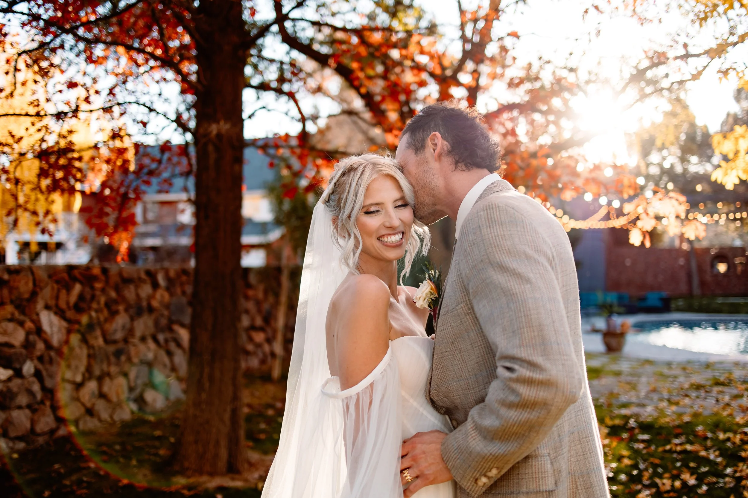 a bride smiles as her new groom whispers in her ear, el paso tx wedding photographer, elopement photographer, couple photographer