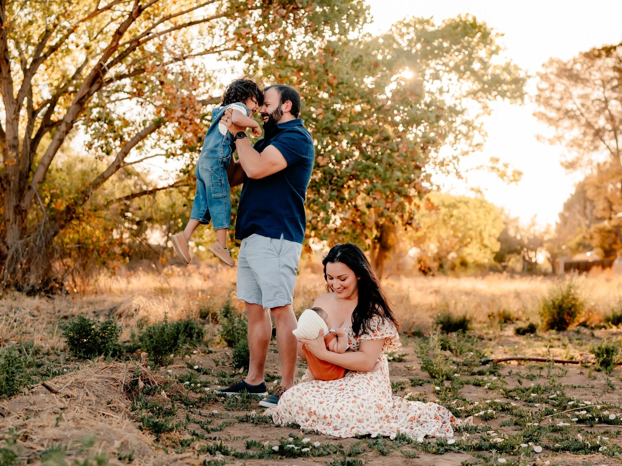 candid moment of my family in a field with trees