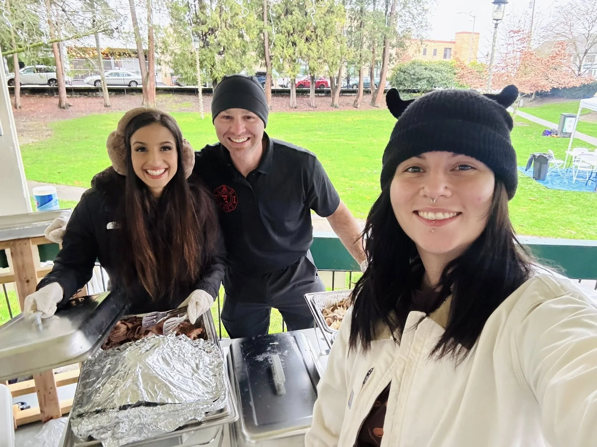 Commissioner Emily Clouse and Commissioner Wayne Fournier serving meals to the public