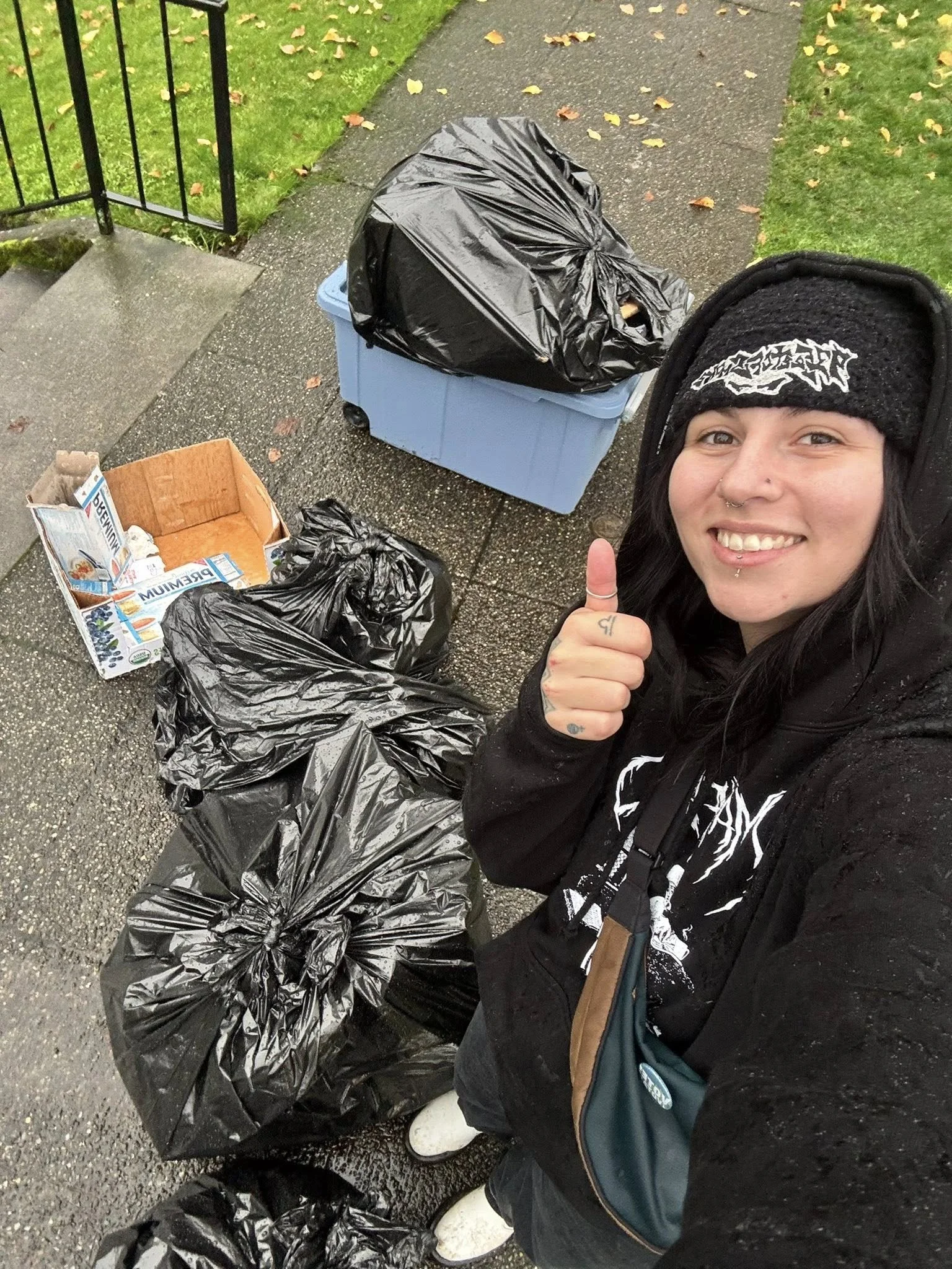 Commissioner Emily Clouse giving a thumbs up during event clean-up