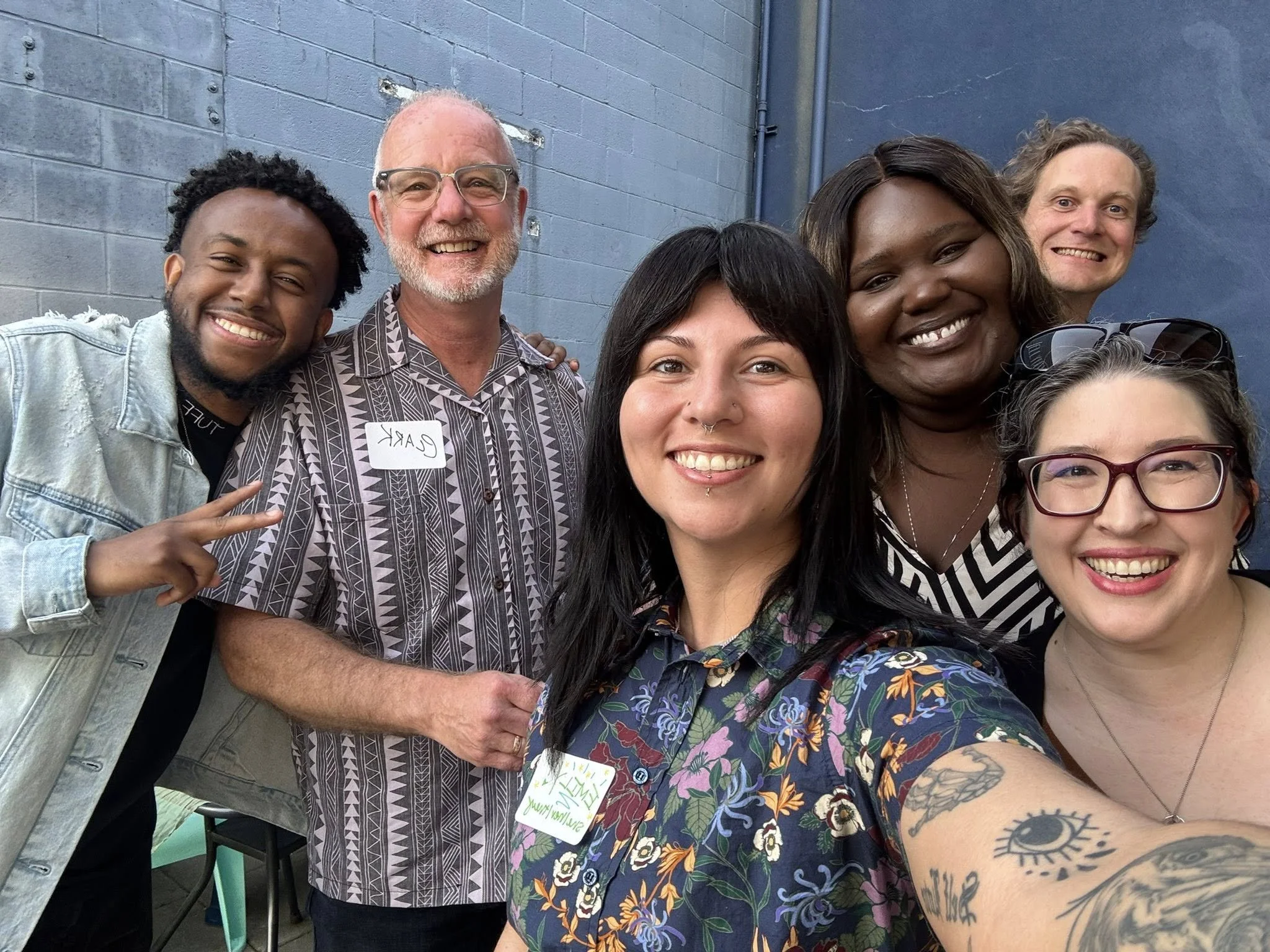 Group of five community members with Commissioner Emily Clouse