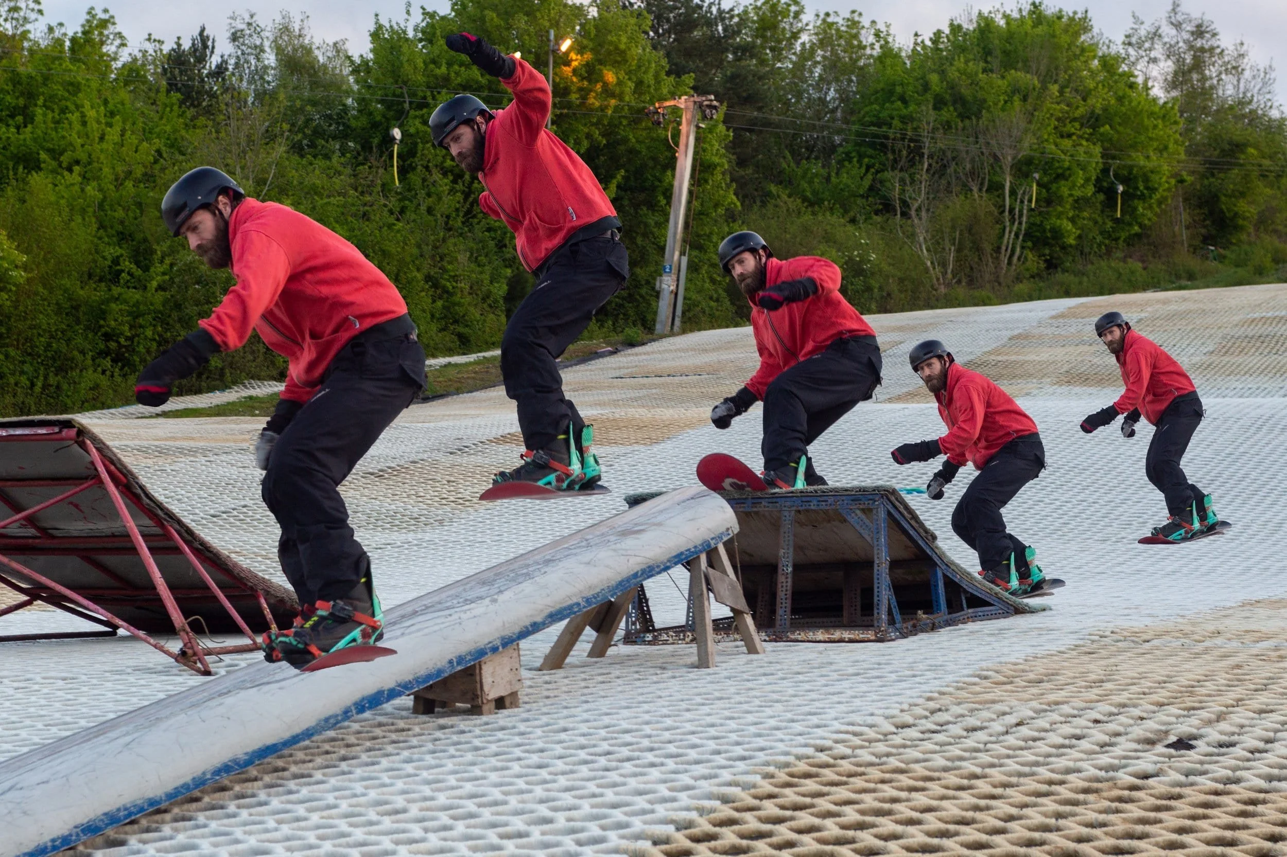 A composite of a snowboarder completing a trick on a rail. ((Taken and made by Faversham Photography)