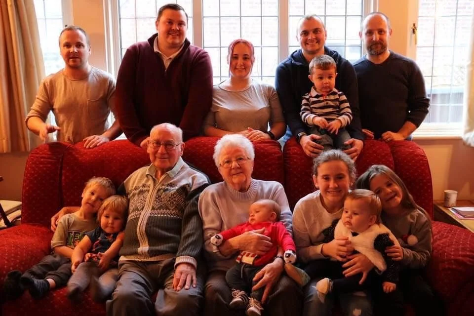 A family portrait of grandparents with their grandchildren and great grand children. (Taken by Faversham Photography)