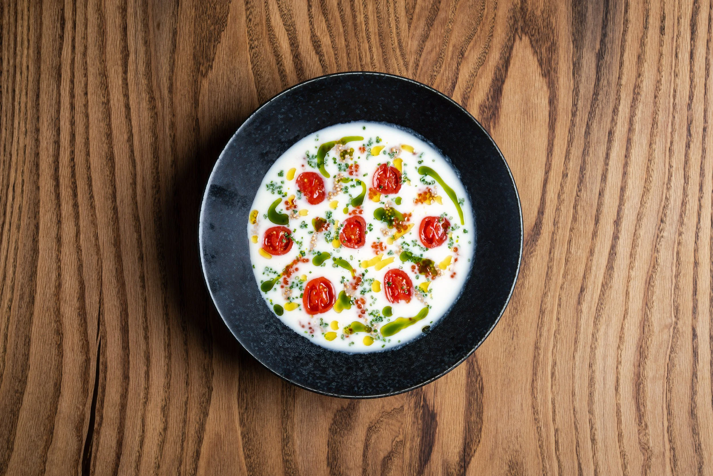 Soup with tomato and garnish