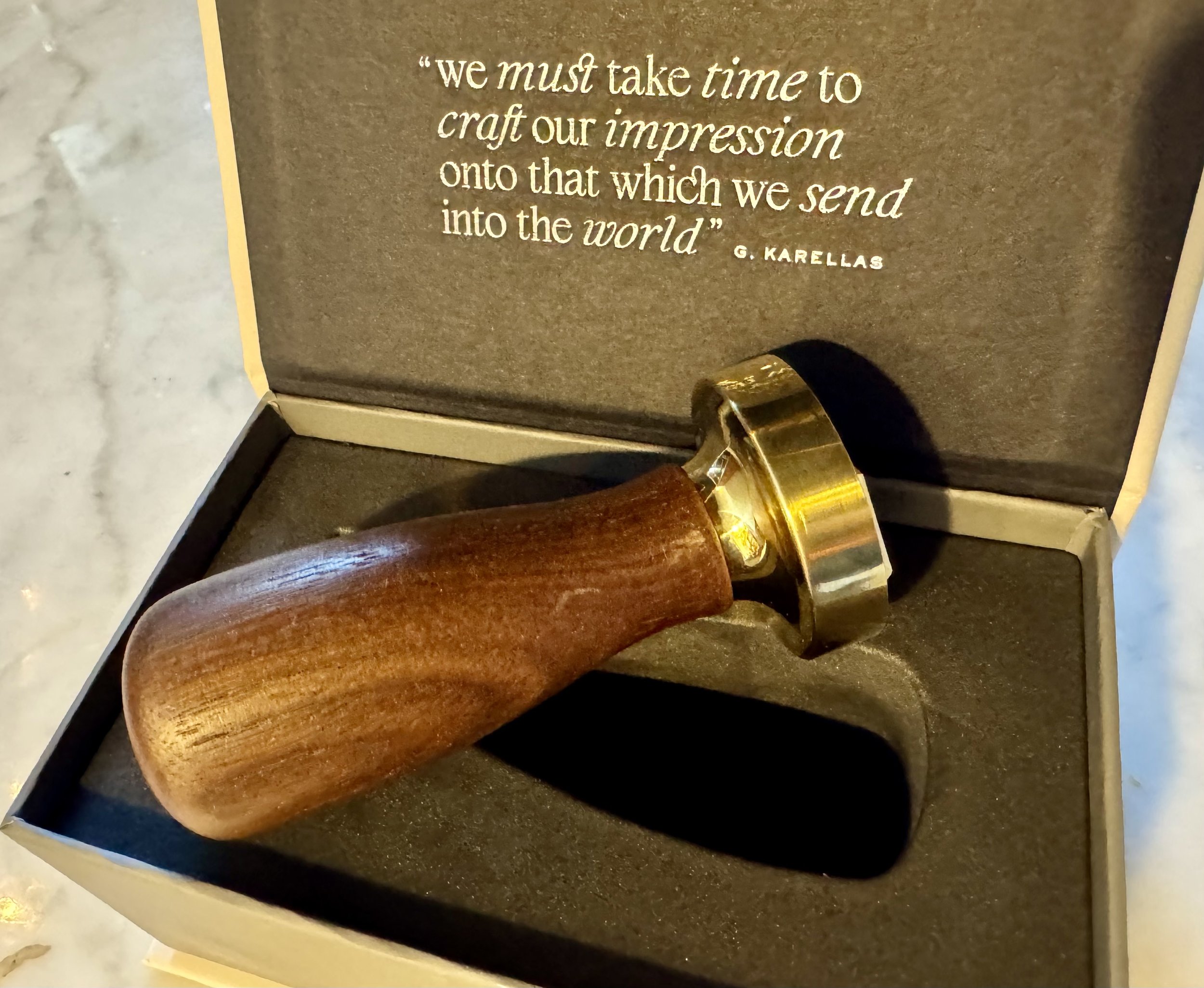 Wood-handled custom ice stamp presented in gift box
