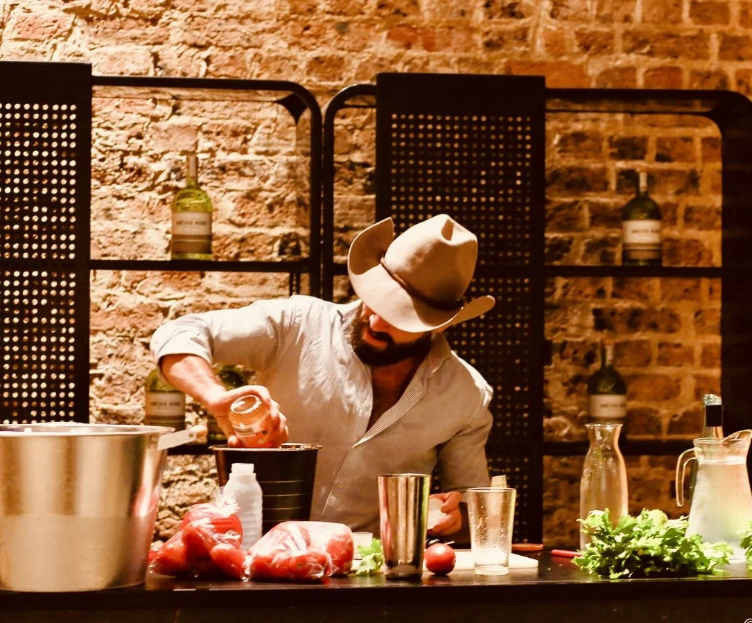 Cocktail station in action — fresh ingredients, copper tools, and full concentration.