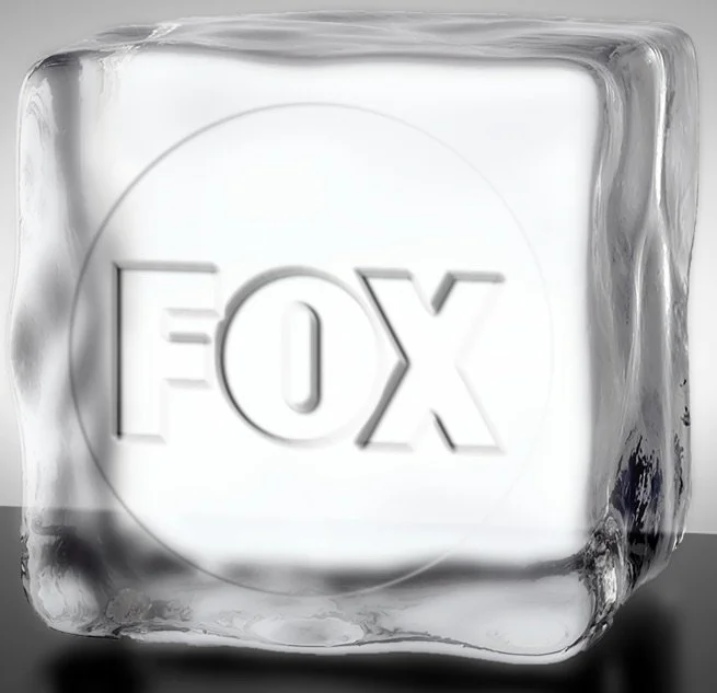 Large crystal-clear ice cube with “FOX” logo stamped in the centre — sleek, premium, and perfectly chilled.