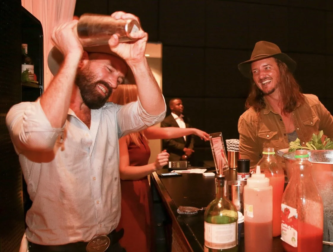 Shaker in motion — high-energy cocktail moment with laughs and libations.