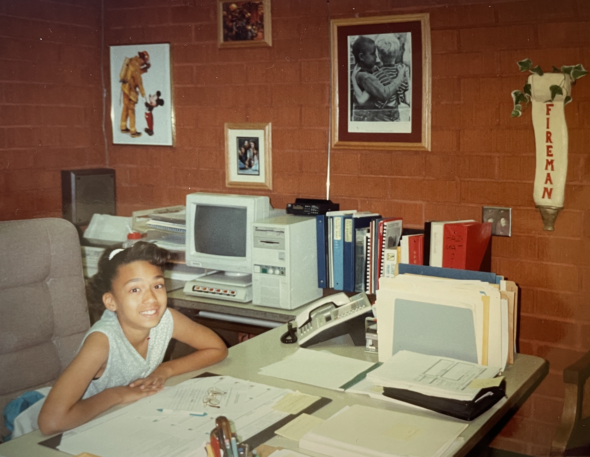 Cheria Young as a child, going to work at the fire station with her dad.