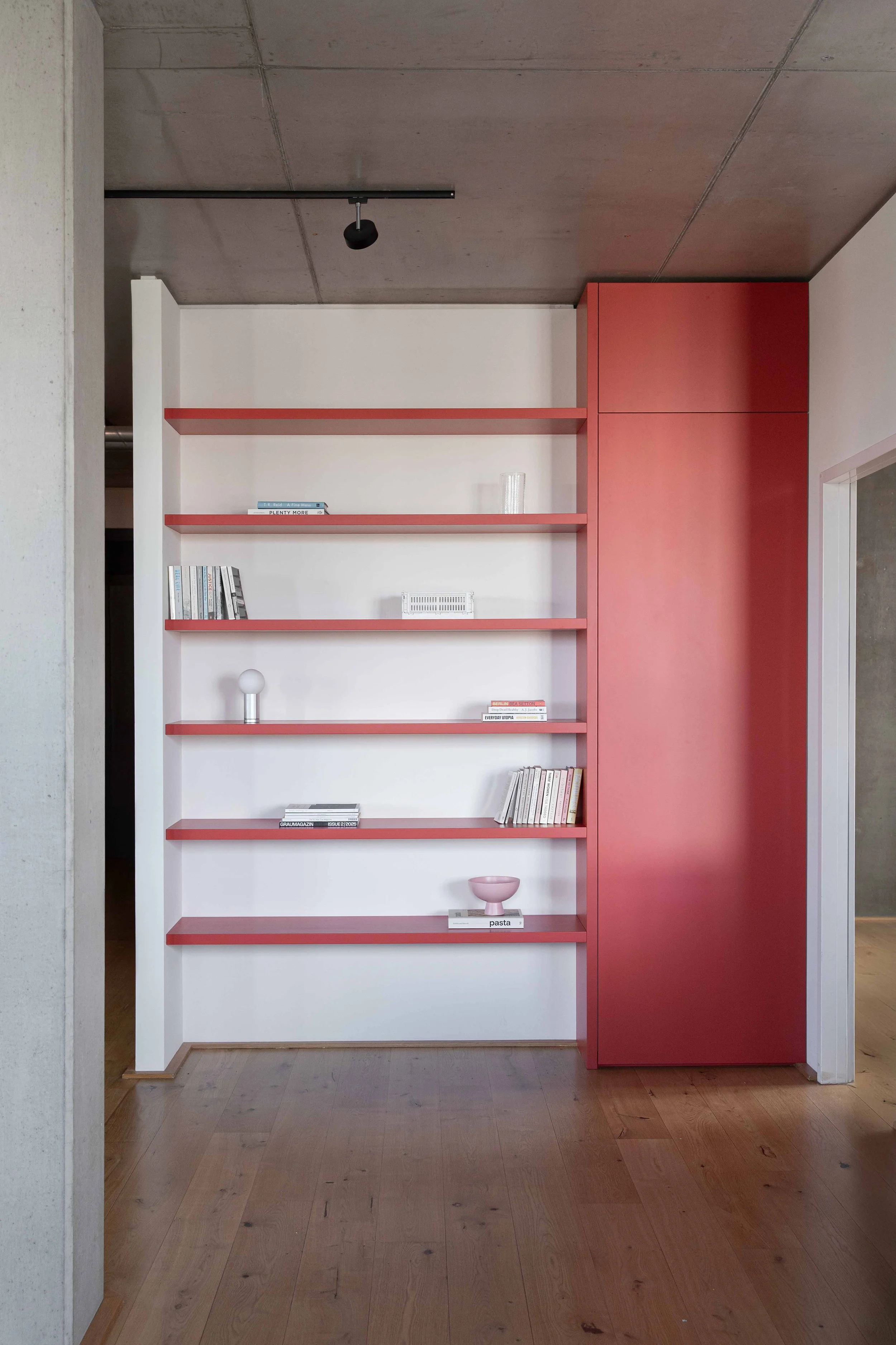 A custom built-in shelf in Farrow & Ball Romesco, Kreuzberg Berlin