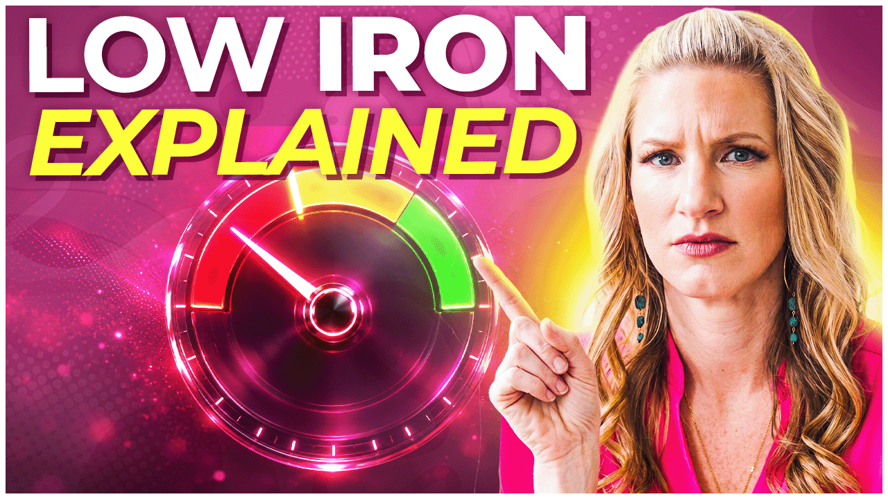 YouTube thumbnail titled 'Low Iron Explained' featuring a woman in pink pointing at a gauge dial ranging from red to green, against a pink background.