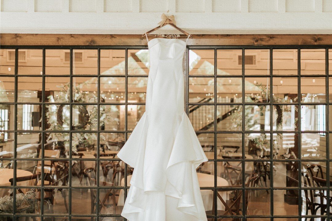 Our double glass barn doors provide the perfect backdrop to this exquisite bridal gown.
