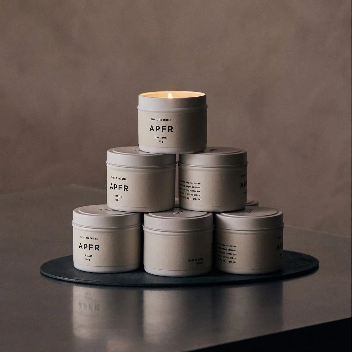 Travel candle tins by APFR &mdash; a little ritual of scent, wherever you go.