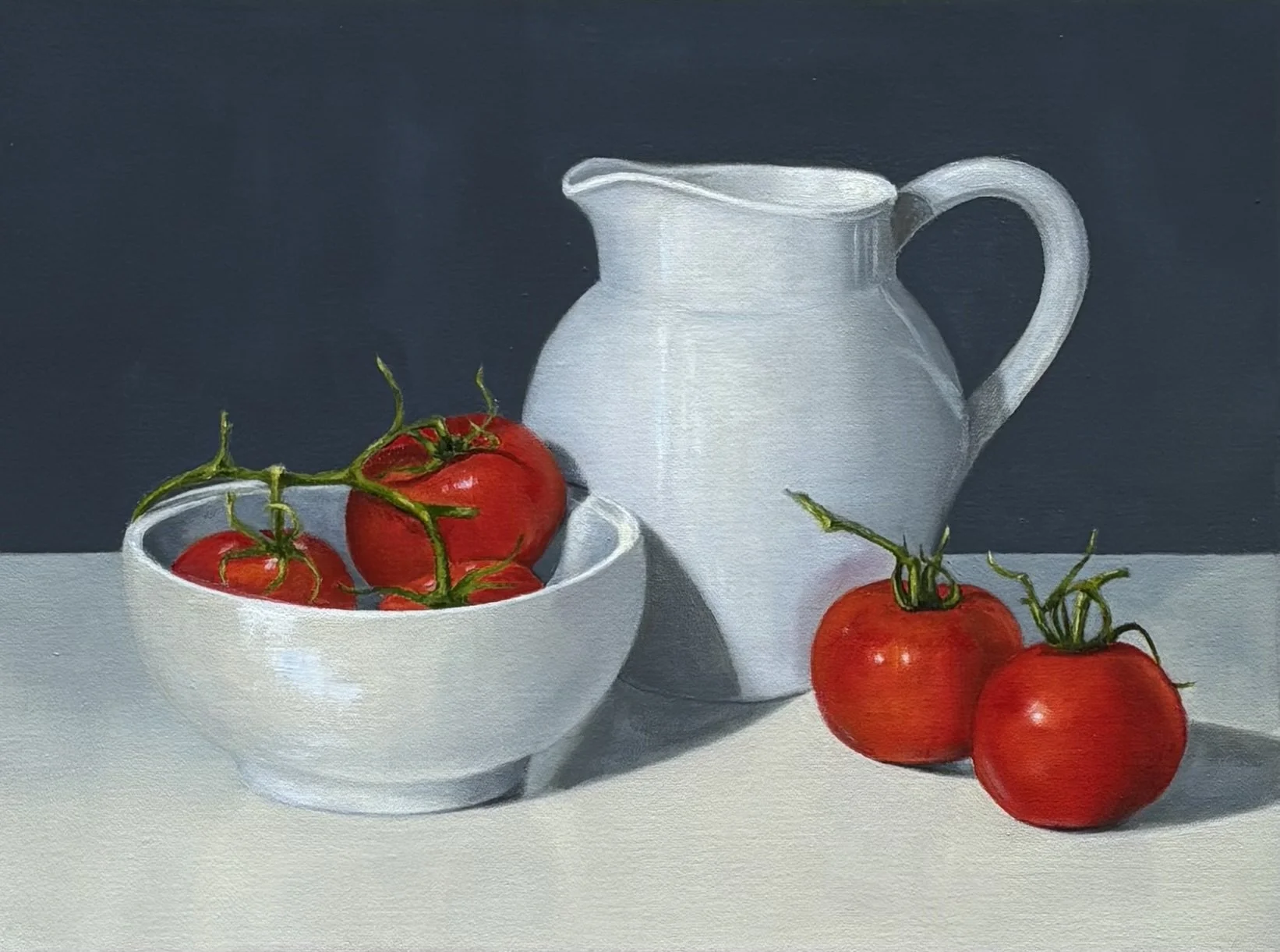Painting of a white bowl with red tomatoes, a white pitcher, and two additional tomatoes on a white surface, with a dark background.