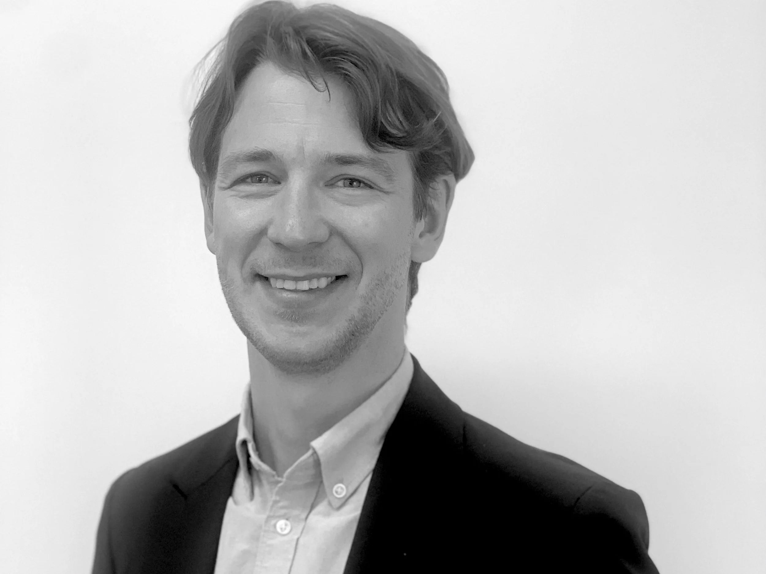 Black and white portrait of Carl Pedler our Director