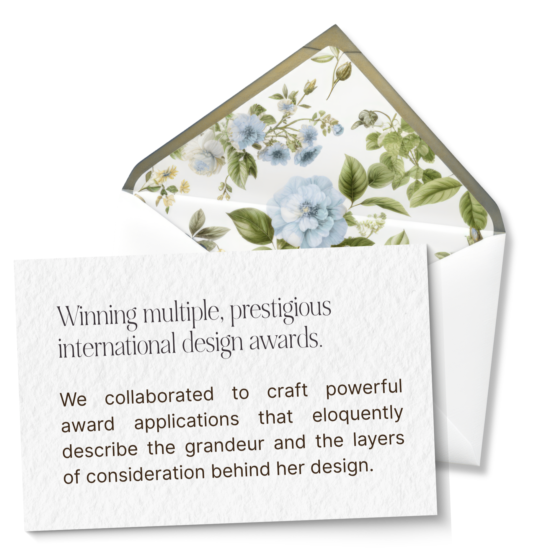 Close-up of a decorative paper with blue flowers and green leaves on the inside of a white envelope. The paper is partially pulled out, revealing printed text.