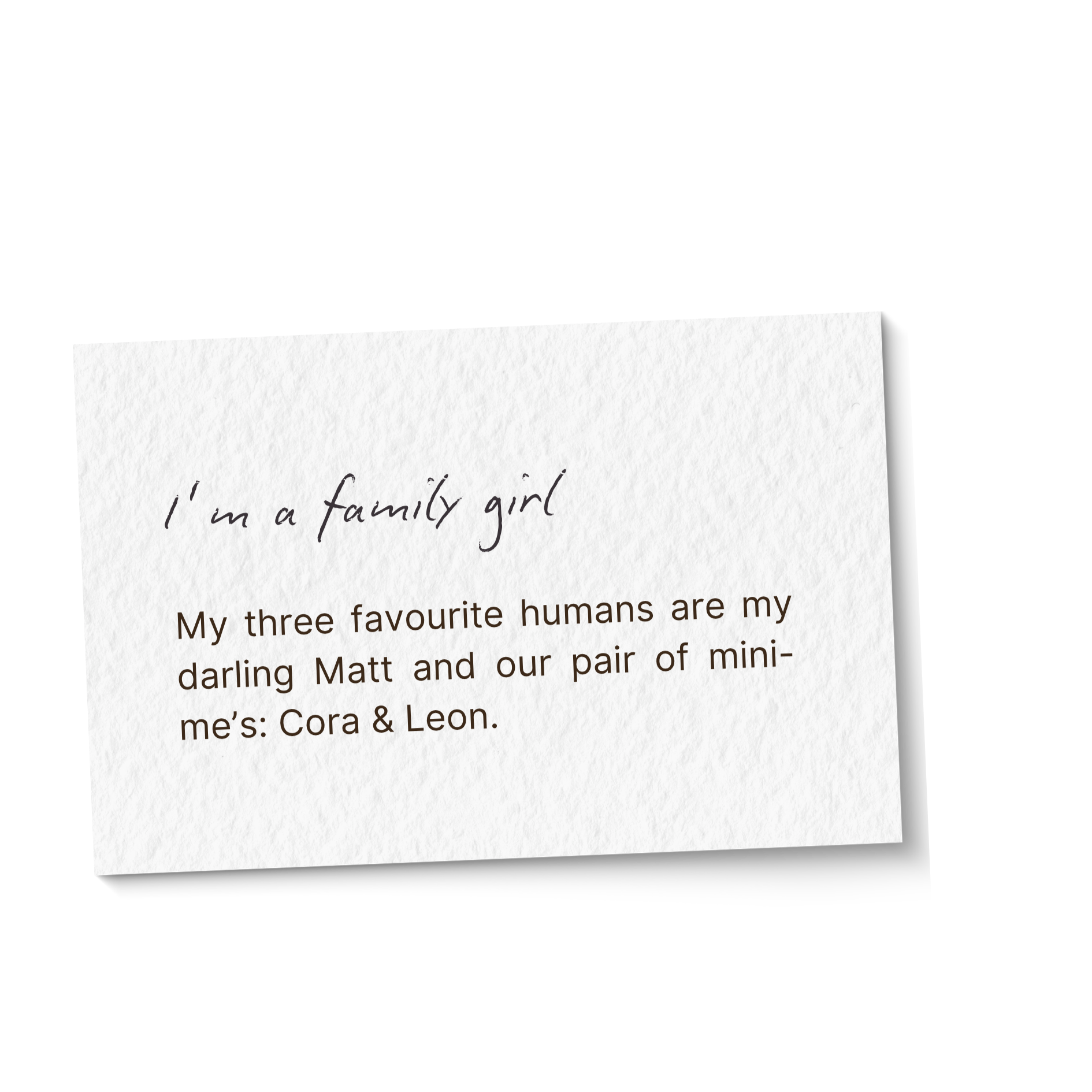 Close-up of handwritten note on white paper with the text 'I'm a family girl' visible, with additional handwritten and printed text partially obscured.