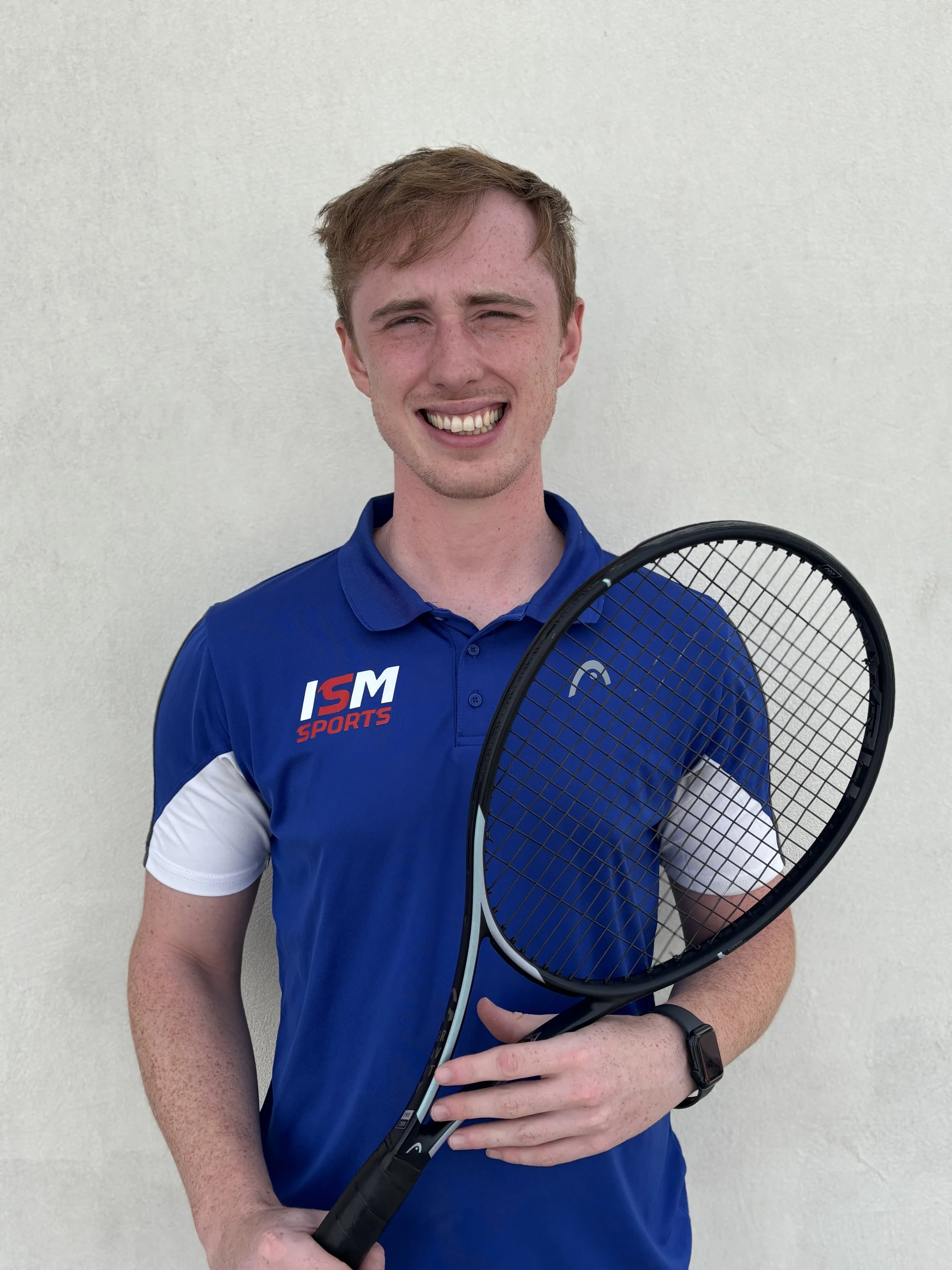Man with beard wearing an ISM Sports shirt