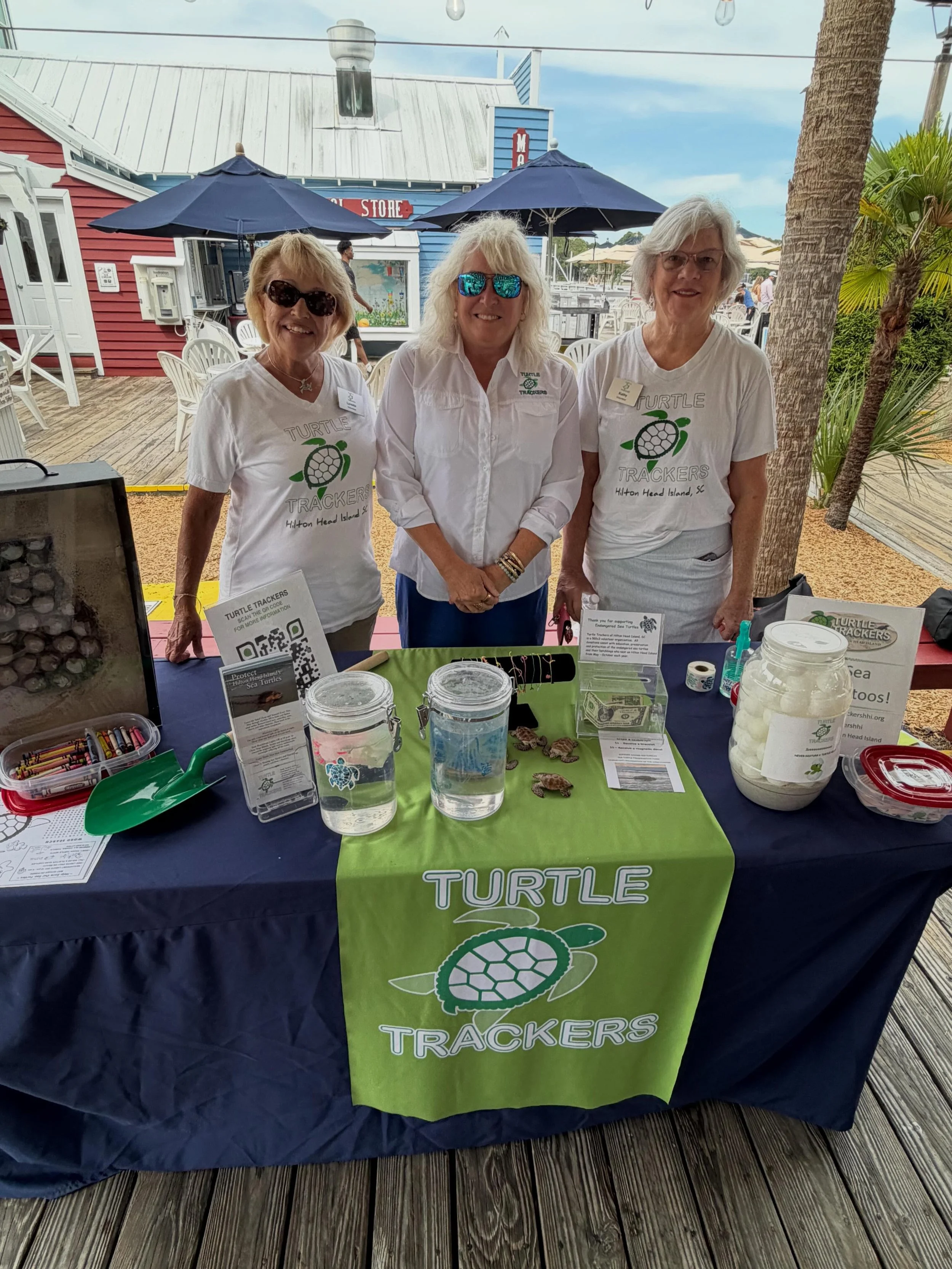 Turtle Tracker Volunteers have been busy this past week- staffing 4 Learning Stations, 3 days of flyers on pizza boxes, working the Dolphin Dash and every night Beach Ambassadors are on the beach - filling holes, knocking down sandcastles and picking