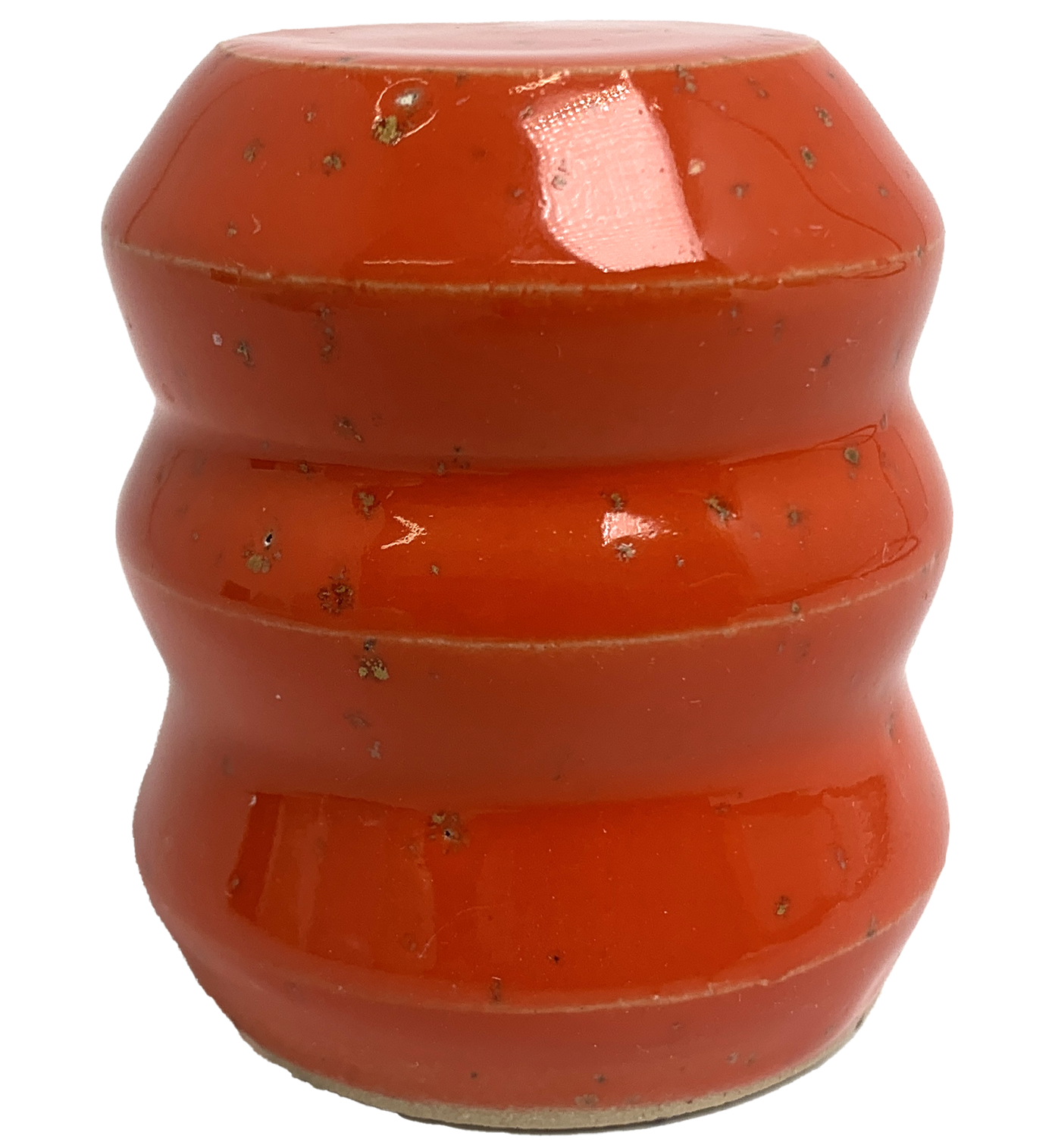 Close-up of glazed ceramic object. It used as an example to indicate the appearance of the glaze. The glaze is red