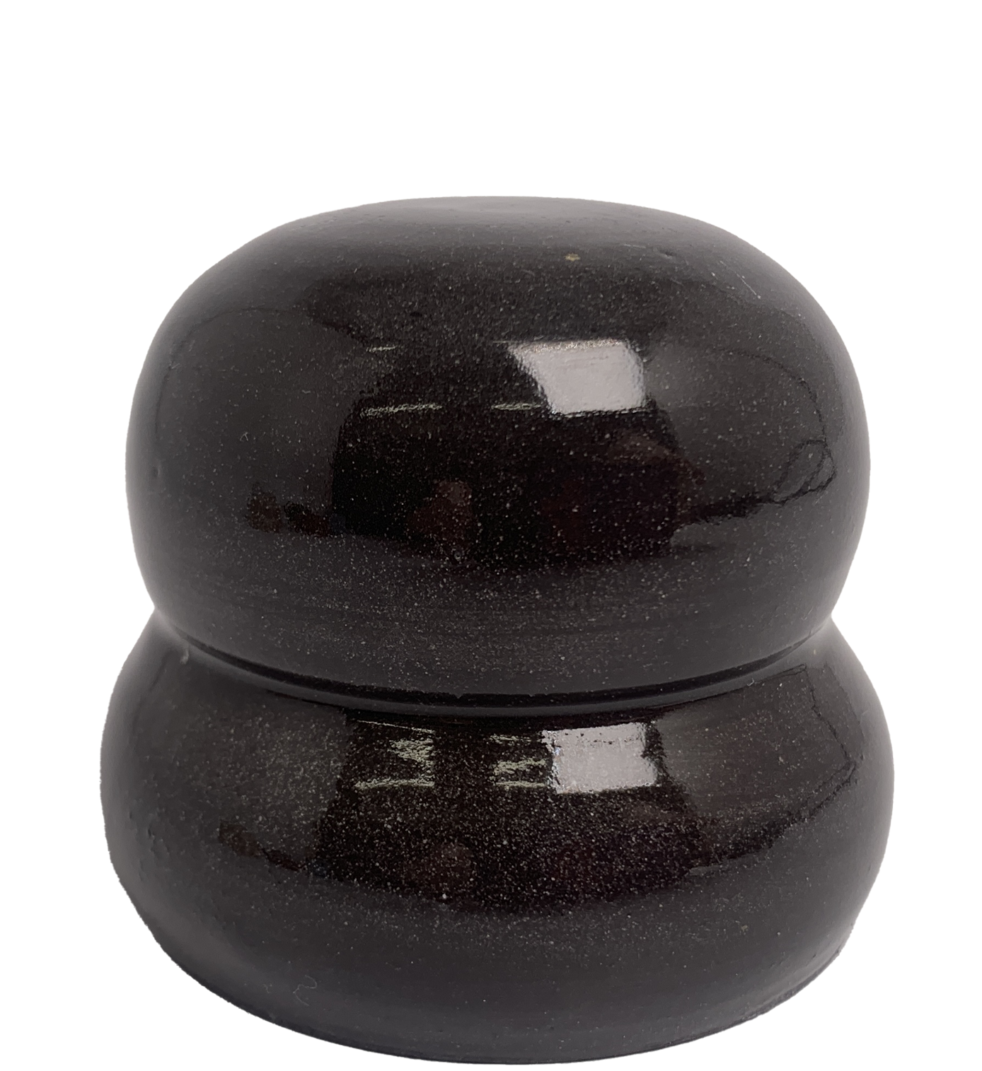 Close-up of glazed ceramic object. It used as an example to indicate the appearance of the glaze. The glaze is black