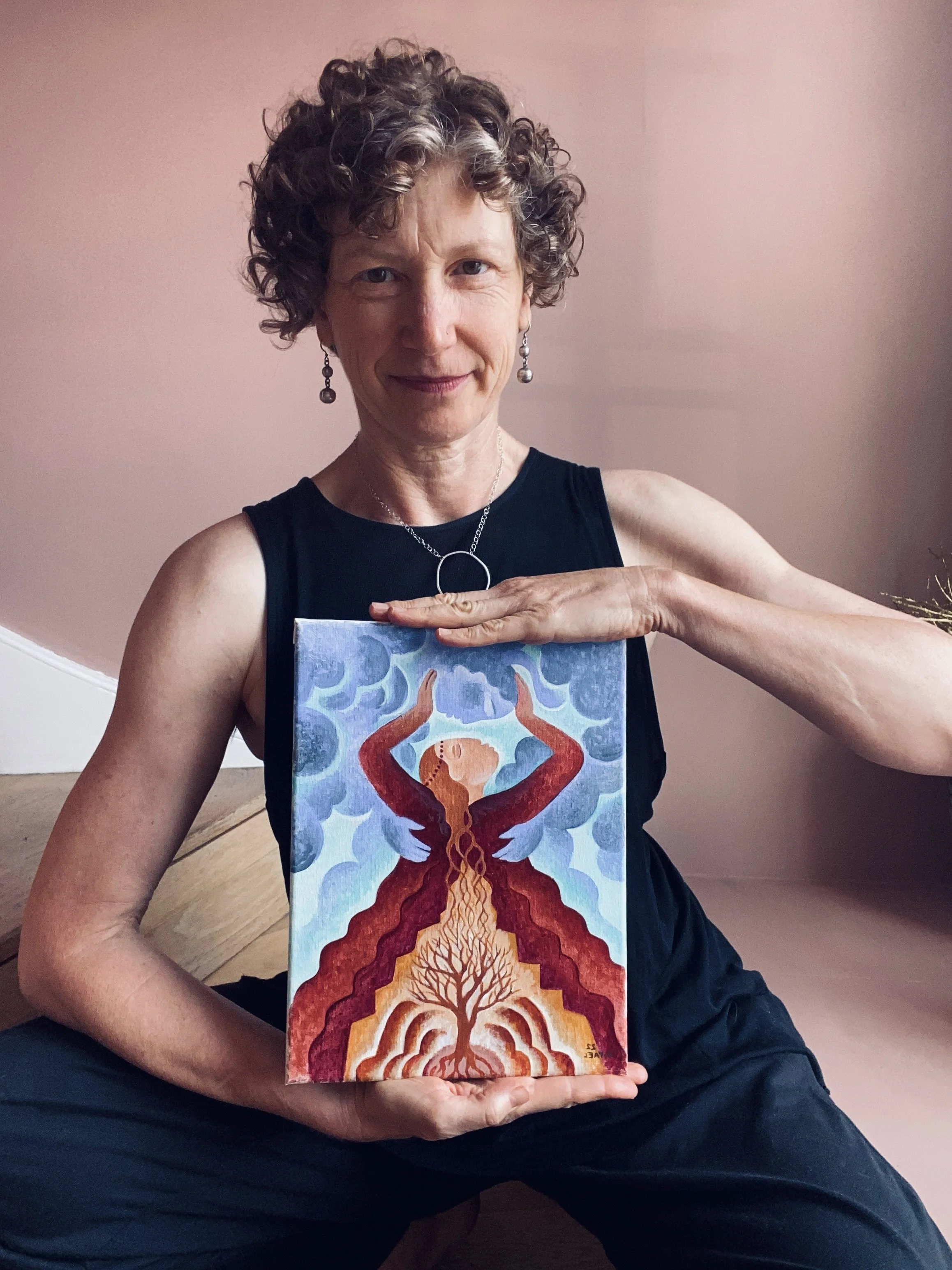 Daven Lee holding the original painting for the Priestess of the Yin card.