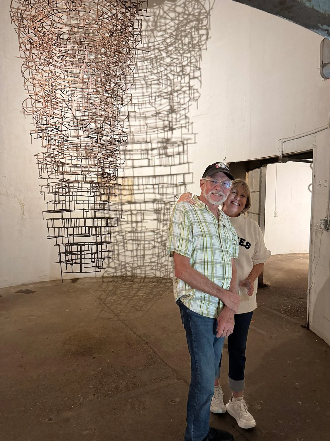 Dan Havel and Sharon Willcutts by Margo Sawyer's installation "Prana/Breath of Life"