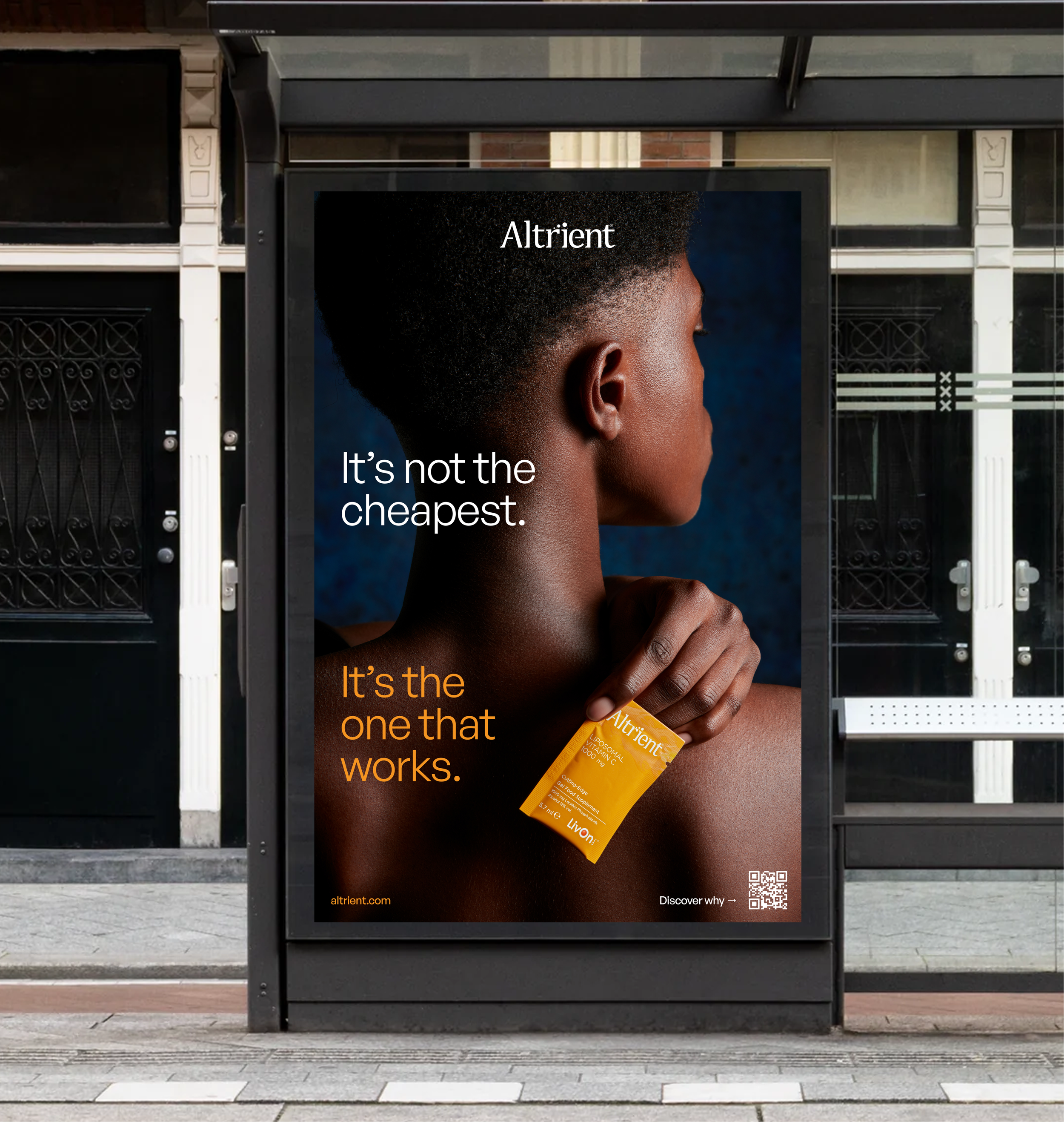 An outdoor advertisement featuring a woman with a shaved hairstyle holding a small orange medication box. The ad for Altrient includes the text "It’s not the cheapest. It’s the one that works."