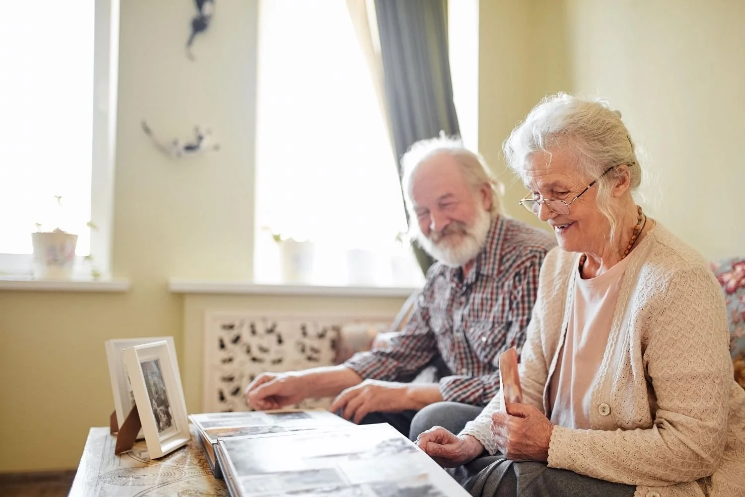 seniors looking at a photo album